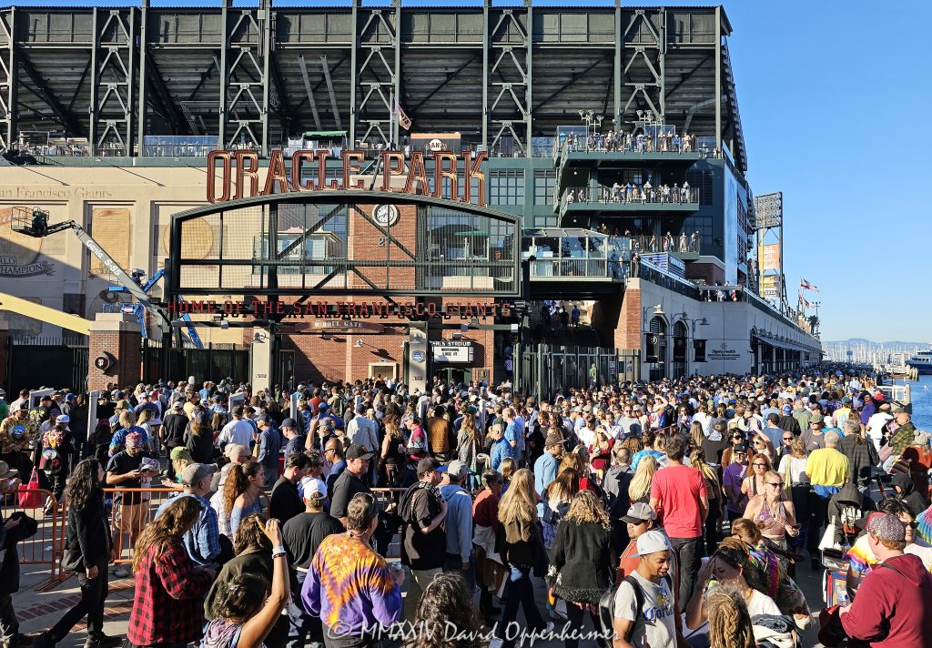 Deadheads at Dead & Company Final Tour at Oracle Park at the Lefty O'Doul Gate by Willie Mays Plaza in San Francisco, California - © 2024 David Oppenheimer - Performance Impressions photography archives - https://performanceimpressions.com Dead & Company, Dead & Company Final Tour, Final Tour, tour, Oracle Park, Grateful Dead, crowd, entrance, enter, stadium, San Francisco, people, fans, deadheads, packed, packed crowd, California, line, SoMA, building, architecture, baseball stadium, 24 Willie Mays Plz, Willie Mays Plaza, 94107, Populous, HOK Sport, HOK Sport Venue Event, outside, O’Doul Gate, Lefty O'Doul Gate, Third Street, gate, concert, concert photography, David Oppenheimer, 1-13985601741,