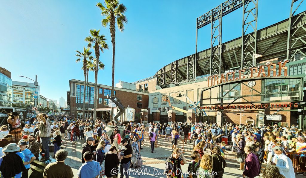 Deadheads at Dead & Company Final Tour at Oracle Park at the Lefty O'Doul Gate by Willie Mays Plaza in San Francisco, California - © 2024 David Oppenheimer - Performance Impressions photography archives - https://performanceimpressions.com Dead & Company, Dead & Company Final Tour, Final Tour, tour, Oracle Park, Grateful Dead, crowd, entrance, enter, stadium, San Francisco, people, fans, deadheads, packed, packed crowd, California, line, SoMA, building, architecture, baseball stadium, 24 Willie Mays Plz, Willie Mays Plaza, 94107, Populous, HOK Sport, HOK Sport Venue Event, hippies, outside, O’Doul Gate, Lefty O'Doul Gate, Third Street, gate, concert, concert photography, David Oppenheimer, 1-13985601741,