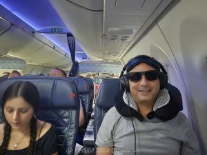 Flying on Delta Air Lines in First Class Father and daughter traveling together aboard a Delta Air Lines flight in the Delta First cabin, seated by the window with headphones, sunglasses, a travel pillow and sleep mask visible. The image presents a candid family air-travel moment in a premium airline cabin – © 2026 David Oppenheimer – Performance Impressions photography archives https://performanceimpressions.com Delta Air Lines, Delta Airlines, Delta flight, Delta First, Delta First Class, Delta Air Lines First Class, flying Delta, flying Delta Air Lines, Delta cabin, first class, first class flight, first class cabin, first class travel, first class seat, airline first class, premium cabin, premium travel, premium airline, airline upgrade, first class upgrade, flight upgrade, cabin upgrade, seat upgrade, upgraded seat, upgraded travel, air travel, airline travel, airplane travel, flying, flight, airline, airplane, aircraft, cabin, airline cabin, airplane cabin, aircraft cabin, airplane interior, aircraft interior, window seat, airplane window seat, airline seat, passenger seat, airline passenger, airplane passenger, passenger, traveler, air traveler, father daughter, father and daughter, father daughter travel, family travel, family flight, family vacation, parent child, parent and child, travel portrait, passenger portrait, airline portrait, inflight portrait, candid travel, candid portrait, travel lifestyle, photographer, travel photographer, aerial photographer, aerial photography, neck pillow, travel pillow, headphones, sunglasses, eye mask, sleep mask, airplane sleep mask, travel accessories, travel gear, inflight comfort, flight comfort, comfortable travel, frequent flyer, frequent flier, airline loyalty, premium seating, premium service, aviation, commercial aviation, commercial airline, passenger aviation, airline industry, air transportation, Delta Air Lines Inc, DAL, NYSE DAL, Delta stock, airline stock, aviation photography, airline photography, travel photography, editorial photography, lifestyle photography, family photography, portrait photography, David Oppenheimer, David Gordon Oppenheimer, David Oppenheimer photographer, David Oppenheimer photography, David Oppenheimer aerial photographer, Performance Impressions, Performance Impressions photography archives, licensing, image licensing, commercial imagery, photography licensing, art, print, fine art, commercial photography, horizontal, 1-15213827141