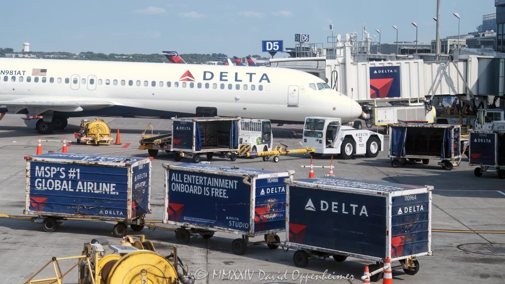 Delta Air Lines jets at Minneapolis–Saint Paul International Airport in Saint Paul, Minnesota aerial view - © 2024 David Oppenheimer - Performance Impressions aerial photography archives - https://performanceimpressions.com Delta, Delta Air Lines, DAL, DAL stock, jets, Minneapolis–Saint Paul International Airport, airport, terminal, MSP, MSP airport, Minnesota, travel, aircraft, airplanes, aviation, ground operations, logistic, air travel, jet set, jetset, planes, United States, color, horizontal, David Oppenheimer, 1-13985601741,