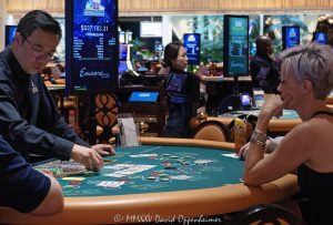 Texas Hold-Em table at Encore Las Vegas Resort and Casino in Las Vegas, Nevada - © 2025 David Oppenheimer - Performance Impressions casino photography archives - https://performanceimpressions.com Encore, Texas Hold-Em, Texas Holdem, poker, poker table, Encore Casino, Encore Las Vegas, Encore Resort, Encore Vegas, Encore at Wynn, Wynn, Wynn Las Vegas, Wynn Resort, Wynn Casino, Wynn Resorts, casino, casino table, gaming, play, betting, bet, wager, win, odds, luck, poker hand, playing cards, dealer, tournament, strategy, poker chips, casino chips, gambling, luxury casino, table game, card game, casino floor, entertainment, luxury gaming, Nevada casino, Las Vegas, Vegas, Las Vegas Strip, 3131 Las Vegas Blvd S, 89109, 3355 S Las Vegas Blvd, 89109, hotel, resort, luxury, five star, vacation, Nevada, Nevada photography, United States, vertical, color, 1-14993092111