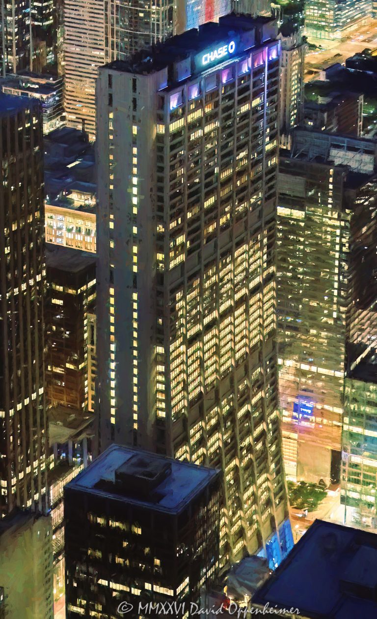 Chase Tower and Exelon Plaza night aerial photo in Chicago, Illinois, showing the 60-story office tower at 21 South Clark Street in the Loop financial district. Elevated nighttime view of the curved skyscraper, illuminated office floors, plaza area, city streets, and downtown commercial architecture near Clark, Dearborn, Madison, and Monroe Streets – © 2026 David Oppenheimer – Performance Impressions aerial photography archives https://performanceimpressions.com Chase Tower, Chase Tower Chicago, Exelon Plaza, Chase Tower Plaza, First National Plaza, First National Bank Building, Bank One Plaza, 21 South Clark, 21 South Clark Street, 21 S Clark, South Clark Street, Clark Street, Chicago, Chicago Illinois, Illinois, United States, 60603, Downtown Chicago, Chicago Loop, Loop, financial district, architecture, Chicago architecture, architectural photography, facade, building exterior, exterior, aerial, aerial photo, aerial photography, aerial photographer, aerial view, aerial image, night aerial, nighttime aerial, night photography, night photo, city lights, building lights, illuminated building, illuminated windows, office lights, nighttime architecture, skyscraper, high-rise, office tower, building, tower, office building, commercial building, corporate tower, corporate headquarters, commercial real estate, corporate real estate, real estate, business district, downtown, urban, curved tower, curved skyscraper, modern architecture, commercial architecture, corporate architecture, office architecture, concrete tower, reinforced concrete, plaza, public plaza, urban plaza, Chagall Four Seasons, Four Seasons mosaic, Marc Chagall, JPMorgan Chase, JP Morgan Chase, Exelon, First National Bank of Chicago, Bank One, C.F. Murphy Associates, CF Murphy Associates, Perkins and Will, Perkins+Will, commercial photography, commercial imagery, image licensing, licensing, photography licensing, art, print, fine art, David Oppenheimer, vertical, 1-15156784411