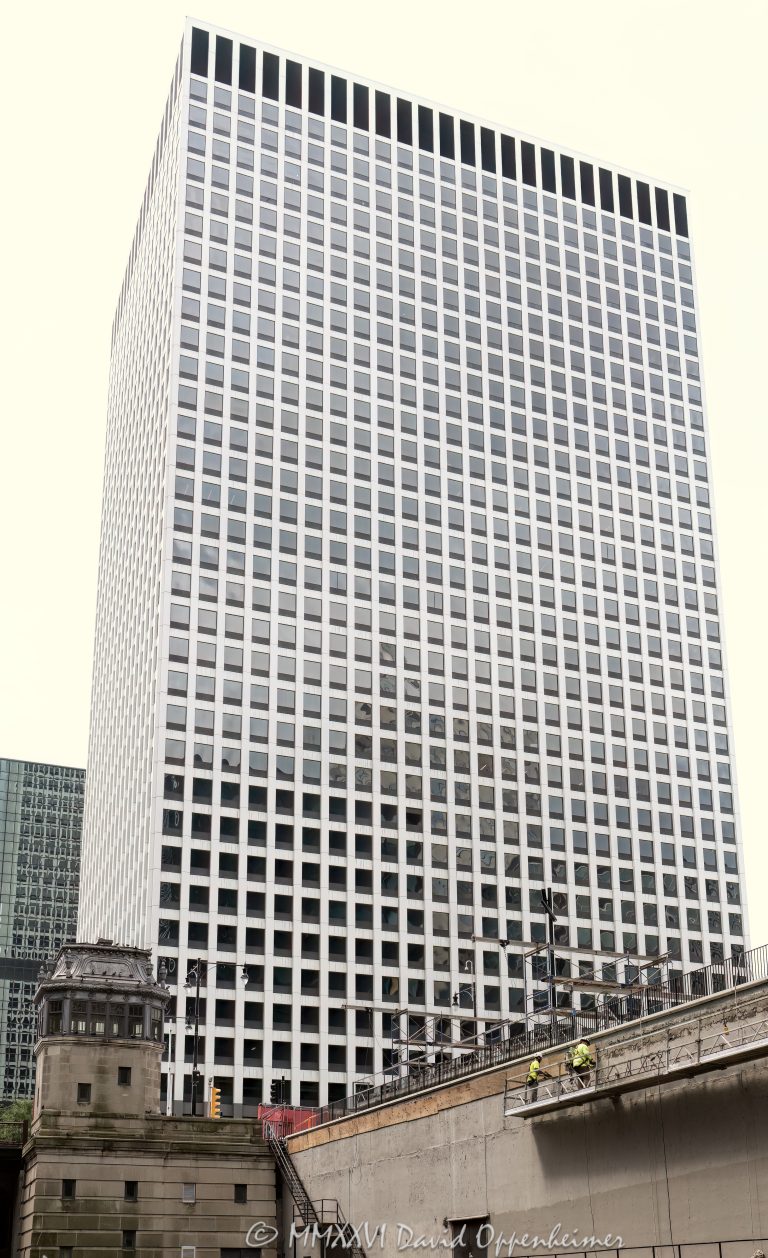 Fifth Third Center at 222 South Riverside Plaza in Chicago, Illinois, located along the Chicago River above Union Station in the Loop financial district. Modern commercial office architecture originally designed by Skidmore, Owings & Merrill, featuring a grid-like glass facade, dark window bands, and strong vertical office tower massing. The Class A office building is also known as Gateway Center III and includes a Fifth Third Bank branch at the South Riverside Plaza address – © 2026 David Oppenheimer – Performance Impressions photography archives https://performanceimpressions.com Fifth Third Center, Fifth Third Center Chicago, Fifth Third Bank, Fifth Third Bank Chicago, Fifth Third, Fifth Third Bancorp, 222 South Riverside, 222 South Riverside Plaza, 222 S Riverside, 222 S Riverside Plaza, South Riverside Plaza, Riverside Plaza, Gateway Center III, Gateway Center, Chicago, Chicago Illinois, Illinois, United States, 60606, Downtown Chicago, Chicago Loop, Loop, financial district, Chicago River, Chicago riverfront, Union Station, Chicago Union Station, architecture, Chicago architecture, architectural photography, facade, building exterior, exterior, modern architecture, commercial architecture, corporate architecture, office architecture, office tower, office building, commercial building, building, tower, high-rise, glass tower, glass building, glass facade, grid facade, grid pattern, window grid, dark windows, window bands, curtain wall, commercial real estate, corporate real estate, real estate, business district, downtown, urban, financial center, business center, Class A office building, Chicago office tower, downtown office tower, Skidmore Owings Merrill, SOM, Wright Heerema Architects, JLL, Fifth Third Bank branch, commercial photography, commercial imagery, image licensing, licensing, photography licensing, art, print, fine art, David Oppenheimer, vertical, 1-15156784411