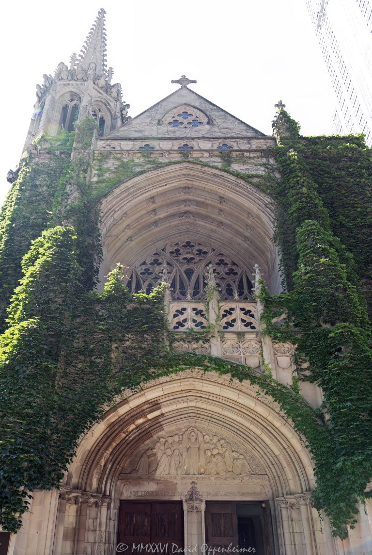 Fourth Presbyterian Church of Chicago at 126 East Chestnut Street rises on the Magnificent Mile with ivy-covered limestone, pointed arches, a tower, carved Gothic tracery, and a cross above the historic sanctuary entrance. Designed by Ralph Adams Cram, the English and French Gothic Revival church was dedicated in 1914 and remains one of North Michigan Avenue’s defining landmarks in Chicago, Illinois – © 2026 David Oppenheimer – Performance Impressions photography archives https://performanceimpressions.com Fourth Presbyterian Church, Fourth Presbyterian Church of Chicago, Fourth Church Chicago, Fourth Church, 126 East Chestnut Street, 126 E Chestnut Street, East Chestnut Street, Chestnut Street, North Michigan Avenue, Michigan Avenue, Magnificent Mile, Mag Mile, Near North Side, Streeterville, downtown Chicago, Chicago, Chicago Illinois, Chicago IL, Illinois, 60611, facade, building exterior, exterior, church exterior, sanctuary exterior, limestone facade, stone facade, stonework, masonry, Bedford limestone, ivy covered, ivy, vines, Gothic Revival, Gothic Revival architecture, English Gothic, French Gothic, Gothic architecture, Gothic church, historic architecture, landmark architecture, church architecture, religious architecture, Chicago architecture, architecture, architectural photography, vertical architecture, church, historic church, Presbyterian church, Presbyterian, sanctuary, tower, church tower, bell tower, spire, cross, Christian cross, stone cross, quatrefoil, trefoil, quatrefoil cross, trefoil cross, tracery, Gothic tracery, carved tracery, pointed arches, Gothic arches, arch, arches, arched entrance, carved stone, carved tympanum, tympanum, doorway, entrance, historic doorway, Michigan Avenue entrance, courtyard, cloister, parish house, Gratz Center, Chicago Landmark, National Register of Historic Places, Old Water Tower District, Great Chicago Fire, Chicago history, Ralph Adams Cram, Howard Van Doren Shaw, Charles J Connick, Frederick Clay Bartlett, Presbyterian Church USA, PCUSA, religion, worship, faith, congregation, tourism, travel, destination, landmark, historic, building, United States, licensing, image licensing, commercial imagery, photography licensing, art, print, fine art, commercial photography, David Oppenheimer, vertical, 1-15213827141