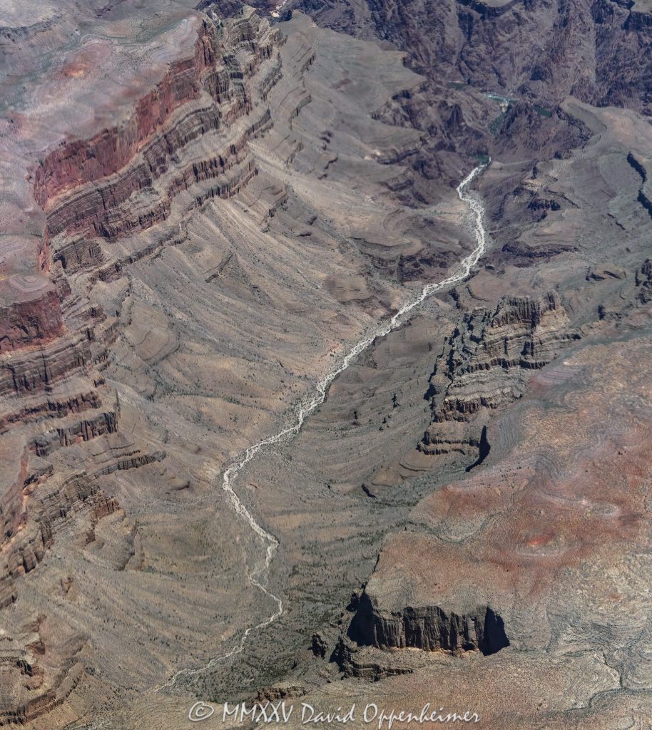 Grand Canyon Aerial View of Bridge Canyon Grand Canyon aerial view of Bridge Canyon with the Colorado River winding between steep cliffs and exposed rock layers. Located within the Hualapai Indian Reservation in Mohave County, Arizona, this section of the canyon features rugged walls and deep channels that highlight the dramatic vertical scale of the terrain – © 2025 David Oppenheimer – Performance Impressions aerial photography archives – https://performanceimpressions.com Grand Canyon, Grand Canyon aerial, Grand Canyon aerial view, Grand Canyon aerial photography, Bridge Canyon, Bridge Canyon aerial, canyon, Colorado River, Hualapai Indian Reservation, canyon cliffs, canyon walls, sandstone cliffs, desert canyon, aerial desert landscape, Bridge Canyon Rapids, Pack Trail, Arizona, Arizona aerial, Grand Canyon geology, erosion, layered rock, valley, Grand Canyon National Park, canyon channel, national park, boundary, border, natural wonder, Mohave County, Mohave County aerial, Lake Mead National Recreation Area, aerial photography, aerial landscape, scenic view, vertical, 1-14993092111