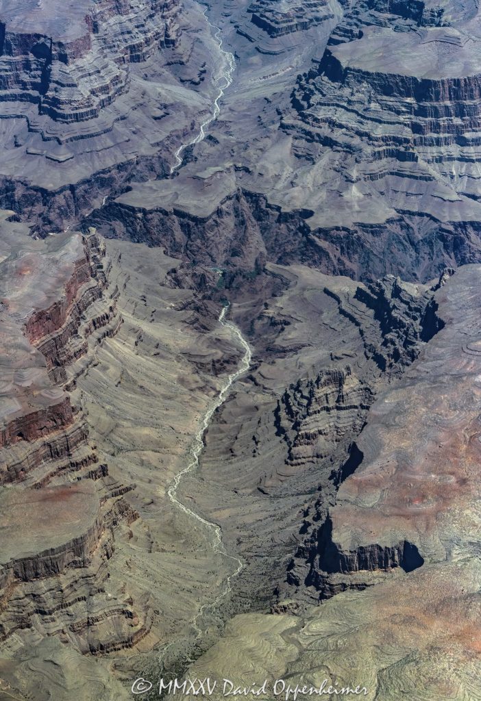 Grand Canyon Aerial View of Bridge Canyon Grand Canyon aerial view of Bridge Canyon with the Colorado River winding between steep cliffs and exposed rock layers. Located within the Hualapai Indian Reservation in Mohave County, Arizona, this section of the canyon features rugged walls and deep channels that highlight the dramatic vertical scale of the terrain – © 2025 David Oppenheimer – Performance Impressions aerial photography archives – https://performanceimpressions.com Grand Canyon, Grand Canyon aerial, Grand Canyon aerial view, Grand Canyon aerial photography, Bridge Canyon, Bridge Canyon aerial, canyon, Colorado River, Hualapai Indian Reservation, canyon cliffs, canyon walls, sandstone cliffs, desert canyon, aerial desert landscape, Bridge Canyon Rapids, Pack Trail, Arizona, Arizona aerial, Grand Canyon geology, erosion, layered rock, valley, Grand Canyon National Park, canyon channel, national park, boundary, border, natural wonder, Mohave County, Mohave County aerial, Lake Mead National Recreation Area, aerial photography, aerial landscape, scenic view, vertical, 1-14993092111