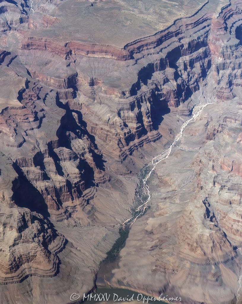 Grand Canyon Aerial View of Burnt Canyon Grand Canyon aerial view of Burnt Canyon with the Colorado River running northwest from the Colorado River within the Hualapai Indian Reservation in Mohave County, Arizona – © 2025 David Oppenheimer – Performance Impressions aerial photography archives – https://performanceimpressions.com Grand Canyon, Grand Canyon aerial, Grand Canyon aerial view, Grand Canyon aerial photography, Burnt Canyon, Burnt Canyon aerial, canyon, Colorado River, Hualapai Indian Reservation, Hualapai, rocks, rocky, cliffs, canyon walls, sandstone cliffs, desert landscape, landscape, Burnt Canyon Rapids, Arizona, Arizona aerial, wash, Grand Canyon geology, erosion, layered rock, valley, Grand Canyon National Park, canyon channel, national park, boundary, border, natural wonder, Mohave County, Mohave County aerial, Lake Mead National Recreation Area, Waterfall Rapids, waterfall, rapids, forbidden, forbidden zone, protected, habitat, ecology, Quartermaster Canyon, Burnt Canyon Trail, trail, Burnt Springs Canyon, plateau, Sanup Plateau, Grand Wash Cliffs, desert, desert canyon, arid, rim, overlook, sedimentary, aerial photography, aerial landscape, scenic view, vertical, 1-14993092111