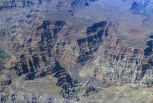 Grand Canyon aerial view of Lower Granite Gorge by Weeping Cliffs at the end of Cave Canyon with the Colorado River below the Sanup Plateau in the Hualapai Indian Reservation in Mohave County, Arizona – © 2025 David Oppenheimer – Performance Impressions aerial photography archives – https://performanceimpressions.com Grand Canyon, Grand Canyon aerial, Grand Canyon aerial view, Grand Canyon aerial photography, Lower Granite Gorge, Cave Canyon, Weeping Cliffs, Sanup, Sanup Plateau, Lake Mead, Grand Wash Cliffs, caves, Muav, Muav Caves, Rampart Cave, Grand Wash, Pearce Canyon, beach, riverfront, river, canyon, Colorado River, Hualapai Indian Reservation, Hualapai, rocks, granite, rocky, cliffs, canyon walls, confluence, sandstone cliffs, desert landscape, aerial, landscape, Arizona, Arizona aerial, wash, Grand Canyon geology, erosion, layered rock, valley, Grand Canyon National Park, canyon channel, national park, boundary, border, natural wonder, schist, Precambrian, plateau, Mohave County, Mohave County aerial, Lake Mead National Recreation Area, rapids, mesa, forbidden, forbidden zone, protected, habitat, ecology, trail, plateau, nature, desert, desert canyon, arid, rim, overlook, sedimentary, aerial photography, scenic view, horizontal, United States, color, 1-14993092111
