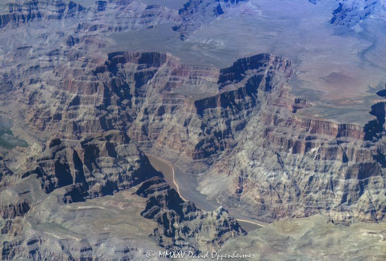 Grand Canyon aerial view of Lower Granite Gorge by Weeping Cliffs at the end of Cave Canyon with the Colorado River below the Sanup Plateau in the Hualapai Indian Reservation in Mohave County, Arizona – © 2025 David Oppenheimer – Performance Impressions aerial photography archives – https://performanceimpressions.com Grand Canyon, Grand Canyon aerial, Grand Canyon aerial view, Grand Canyon aerial photography, Lower Granite Gorge, Cave Canyon, Weeping Cliffs, Sanup, Sanup Plateau, Lake Mead, Grand Wash Cliffs, caves, Muav, Muav Caves, Rampart Cave, Grand Wash, Pearce Canyon, beach, riverfront, river, canyon, Colorado River, Hualapai Indian Reservation, Hualapai, rocks, granite, rocky, cliffs, canyon walls, confluence, sandstone cliffs, desert landscape, aerial, landscape, Arizona, Arizona aerial, wash, Grand Canyon geology, erosion, layered rock, valley, Grand Canyon National Park, canyon channel, national park, boundary, border, natural wonder, schist, Precambrian, plateau, Mohave County, Mohave County aerial, Lake Mead National Recreation Area, rapids, mesa, forbidden, forbidden zone, protected, habitat, ecology, trail, plateau, nature, desert, desert canyon, arid, rim, overlook, sedimentary, aerial photography, scenic view, horizontal, United States, color, 1-14993092111