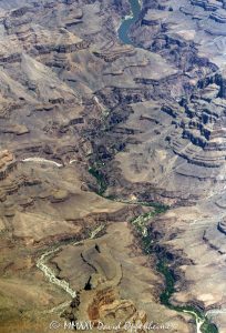 Grand Canyon aerial view of Meriwhitica Canyon in Lower Granite Gorge with the Colorado River on the Hualapai Indian Reservation in Mohave County, Arizona – © 2025 David Oppenheimer – Performance Impressions aerial photography archives – https://performanceimpressions.com Meriwhitica Canyon, Meriwhitica, Meriwhitica Springs, Indian Gardens, Spencer Springs, Lava Cliff Rapids, Spencer Canyon, Lower Granite Gorge, Lake Mead, caves, beach, riverfront, river, canyon, Colorado River, Hualapai Indian Reservation, Hualapai, rocks, granite, rocky, cliffs, canyon walls, confluence, sandstone cliffs, desert landscape, aerial, landscape, Arizona, Arizona aerial, wash, Grand Canyon geology, erosion, layered rock, valley, Grand Canyon National Park, canyon channel, national park, boundary, border, natural wonder, schist, Precambrian, plateau, Mohave County, Mohave County aerial, Lake Mead National Recreation Area, rapids, mesa, forbidden, forbidden zone, protected, habitat, ecology, trail, plateau, nature, desert, desert canyon, arid, rim, overlook, sedimentary, aerial photography, scenic view, vertical, United States, color, 1-14993092111