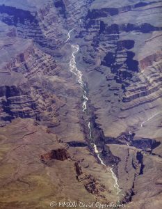 Grand Canyon aerial view of Separation Canyon in Lower Granite Gorge crossing the Colorado River on the boundary of the Hualapai Indian Reservation in Mohave County, Arizona – © 2025 David Oppenheimer – Performance Impressions aerial photography archives – https://performanceimpressions.com Grand Canyon, Grand Canyon aerial, Separation Canyon, Separation Canyon aerial, Grand Canyon aerial photography, beach, riverfront, river, Lower Granite Gorge, canyon, Colorado River, Hualapai Indian Reservation, Hualapai, rocks, rocky, cliffs, canyon walls, sandstone cliffs, desert landscape, aerial, landscape, Arizona, Arizona aerial, wash, geology, Grand Canyon geology, erosion, layered rock, valley, Grand Canyon National Park, canyon channel, national park, boundary, border, natural wonder, Separation Rapids, Littlefield, West Fork, Mohave County, Mohave County aerial, Lake Mead National Recreation Area, waterfall, rapids, forbidden, forbidden zone, protected, habitat, ecology, trail, plateau, Sanup Plateau, Grand Wash, desert, desert canyon, arid, rim, overlook, sedimentary, aerial photography, scenic view, vertical, United States, color, 1-14993092111