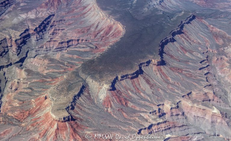 Grand Canyon National Park aerial view of Twin Point Overlook on the Shivwits Plateau in Mohave County, Arizona - © 2025 David Oppenheimer - Performance Impressions aerial photography archives - https://performanceimpressions.com Grand Canyon, Grand Canyon aerial, Twin Point Overlook, Twin Point Overlook aerial, Twin Point, Twin Point Aerial, Shivwits Plateau, Shivwits Plateau aerial, Sanup Plateau, plateau, plateau aerial, Red Rock Spring, Burnt Canyon, Surprise Canyon, Surprise Canyon Formation, conglomerate, Mississippian, Pennsylvanian, siltstone, channel fill, sinks, channel, ravines, Supai Group, Grand Canyon National Park, Grand Canyon National Park aerial, Arizona, Arizona aerial, ravine, Mohave County, Mohave County aerial, valley, valley aerial, aerial, aerial view, Hualapai, Hualapai reservation, mountains, arid, barren, Colorado River, canyon, valley, Hualapai Indian Reservation, vacation, gorge, rim, North Rim, view point, Littlefield, Littlefield aerial, Littlefield Arizona, 86432, red, red rocks, cliffs, bottom, lower, aerial photographer, limestone, Redwall Limestone, middle, wash, erosion, geology, rocks, erode, scenic, landscape, Lake Mead National Recreation Area, overlook, sandstone, rocky, canyon walls, visit, travel, American West, native lands, desert, high desert, advertising, United States, USA, America, national park, Grand Canyon Village, horizontal, 1-14993092111
