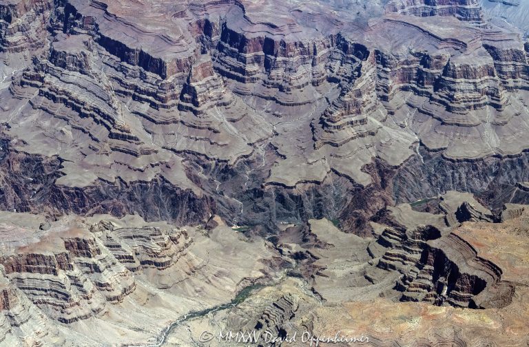 Grand Canyon National Park aerial view of Travertine Cavern Falls area at River Mile 229 along the Colorado River near the boundary of the Hualapai Indian Reservation in Mohave County, Arizona – © 2025 David Oppenheimer – Performance Impressions aerial photography archives – https://performanceimpressions.com Grand Canyon, Grand Canyon aerial, Travertine Cavern, Travertine Cavern Falls, Travertine Cavern aerial, Travertine Rapids, grotto, natural grotto, spring water, waterfall, cavern, remote, cave, aerial view, aerial photo, beach, riverfront, river, canyon, Colorado River, rocks, granite, rocky, cliffs, canyon walls, sandstone cliffs, aerial, landscape, Arizona, Arizona aerial, wash, Grand Canyon geology, erosion, geology, layered rock, valley, Grand Canyon National Park, canyon channel, national park, boundary, border, natural wonder, schist, Precambrian, plateau, slot canyon, Mohave County, Mohave County aerial, Lake Mead National Recreation Area, table, green, red, mesa, habitat, ecology, trail, nature, desert, desert canyon, desert landscape, arid, rim, overlook, sedimentary, aerial photography, scenic view, Mile 229, calcium carbonate, United States, color, aerial photographer, America, USA, horizontal, 1-14993092111