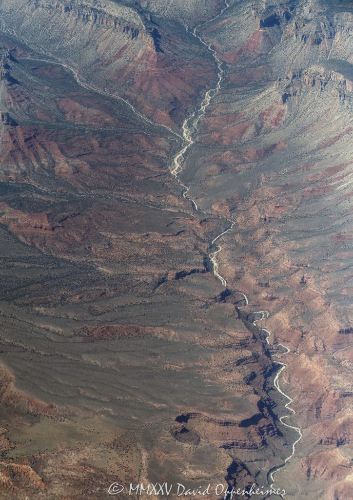 Grand Canyon National Park Aerial View of Twin Spring Canyon Grand Canyon National Park aerial view of Twin Spring Canyon in Mohave County, Arizona - © 2025 David Oppenheimer - Performance Impressions aerial photography archives - https://performanceimpressions.com Grand Canyon, Grand Canyon aerial, Twin Spring Canyon, Twin Spring, Twin Spring Canyon aerial, Twin Creek Canyon, Twin Creek Canyon aerial, Twin Creek, Mathis Spring, Parashant National Monument, Parashant, Lower Spring, Mount Dellenbaugh, Twin Point Overlook, Twin Point, Shivwits Plateau, Shivwits Plateau aerial, Sanup Plateau, plateau, plateau aerial, Red Rock Spring, conglomerate, Mississippian, Pennsylvanian, siltstone, channel fill, sinks, channel, ravines, Supai Group, geology, Grand Canyon National Park, Grand Canyon National Park aerial, Arizona, Arizona aerial, ravine, Mohave County, Mohave County aerial, canyon, valley, valley aerial, aerial, aerial view, Hualapai, Hualapai reservation, mountains, arid, barren, Colorado River, Hualapai Indian Reservation, vacation, gorge, rim, North Rim, view point, Littlefield, Littlefield aerial, Littlefield Arizona, 86432, red, red rocks, cliffs, bottom, lower, aerial photographer, limestone, Redwall Limestone, middle, wash, erosion, geology, rocks, erode, scenic, landscape, Lake Mead National Recreation Area, overlook, sandstone, rocky, canyon walls, visit, travel, Parashant Canyon, American West, native lands, desert, high desert, advertising, United States, USA, America, national park, Grand Canyon Village, vertical, 1-14993092111