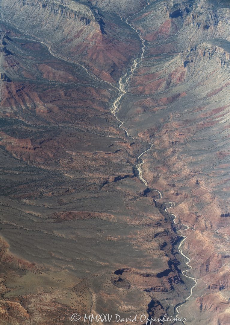 Grand Canyon National Park aerial view of Twin Spring Canyon in Mohave County, Arizona - © 2025 David Oppenheimer - Performance Impressions aerial photography archives - https://performanceimpressions.com Grand Canyon, Grand Canyon aerial, Twin Spring Canyon, Twin Spring, Twin Spring Canyon aerial, Twin Creek Canyon, Twin Creek Canyon aerial, Twin Creek, Mathis Spring, Parashant National Monument, Parashant, Lower Spring, Mount Dellenbaugh, Twin Point Overlook, Twin Point, Shivwits Plateau, Shivwits Plateau aerial, Sanup Plateau, plateau, plateau aerial, Red Rock Spring, conglomerate, Mississippian, Pennsylvanian, siltstone, channel fill, sinks, channel, ravines, Supai Group, geology, Grand Canyon National Park, Grand Canyon National Park aerial, Arizona, Arizona aerial, ravine, Mohave County, Mohave County aerial, canyon, valley, valley aerial, aerial, aerial view, Hualapai, Hualapai reservation, mountains, arid, barren, Colorado River, Hualapai Indian Reservation, vacation, gorge, rim, North Rim, view point, Littlefield, Littlefield aerial, Littlefield Arizona, 86432, red, red rocks, cliffs, bottom, lower, aerial photographer, limestone, Redwall Limestone, middle, wash, erosion, geology, rocks, erode, scenic, landscape, Lake Mead National Recreation Area, overlook, sandstone, rocky, canyon walls, visit, travel, Parashant Canyon, American West, native lands, desert, high desert, advertising, United States, USA, America, national park, Grand Canyon Village, vertical, 1-14993092111