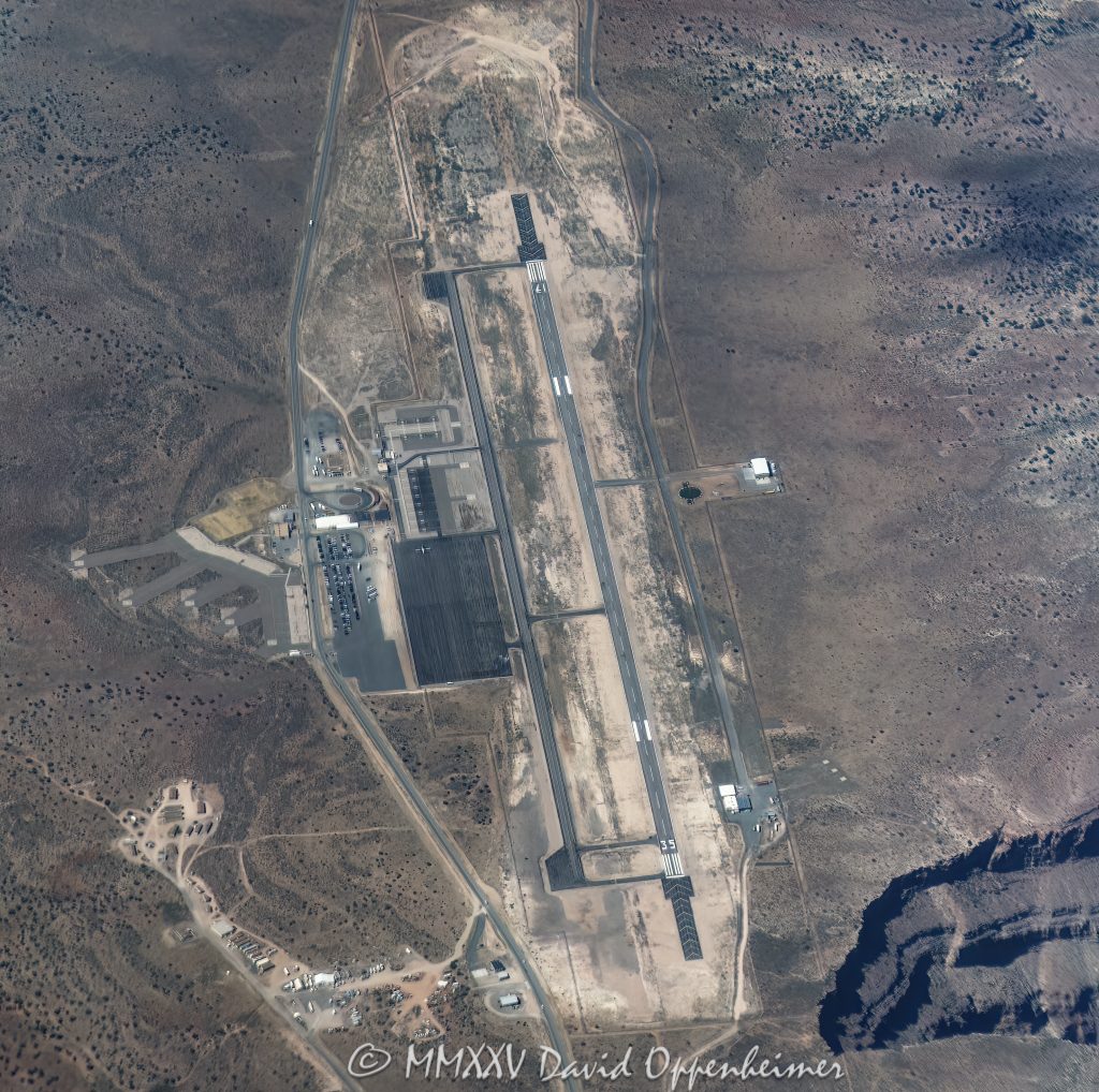 Grand Canyon West Airport Aerial View Grand Canyon West Airport aerial view - © 2025 David Oppenheimer - Performance Impressions aerial aviation photography archives - https://performanceimpressions.com Grand Canyon West Airport, Grand Canyon West Airport aerial, Grand Canyon, Grand Canyon aerial, Grand Canyon airport, Grand Canyon West, Grand Canyon Village, 86434, GCQ, 1G4, Grand Canyon National Park, Grand Canyon National Park aerial, Colorado River, fly, Hualapai, Hualapai reservation, plateau, rocky, rocks, gorge, cavern, sandstone, overlook, mountains, arid, barren, canyon, valley, Hualapai Indian Reservation, summer, aerial, photo, trip, travel, runway, heliport, airport, vacation, Mohave County, rim, South Rim, North Rim, view point, cliffs, landing strip, helicopter, Supai Group, Mississippian, Pennsylvanian, aerial photographer, aerial view, erosion, geology, Arizona, Arizona aerial, scenic, landscape, Lake Mead National Recreation Area, visit, United States, USA, America, Lower Granite Gorge, national park, tour, marketing, advertising, licensing, American West, high desert, native lands, vertical, color, 1-14993092111