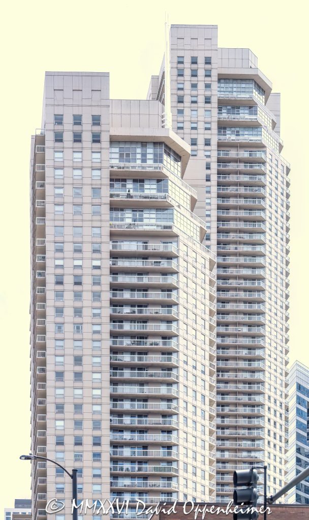 Grand Plaza Apartments at 540 North State Street in Chicago, Illinois, located in the River North neighborhood near Grand Avenue and State Street. Contemporary residential high-rise architecture featuring dual apartment towers above a mixed-use podium with retail and shared amenity space. The full-block development was built in 2003 and includes rental apartments in the east tower and condominium residences in the west tower – © 2026 David Oppenheimer – Performance Impressions photography archives https://performanceimpressions.com Grand Plaza, Grand Plaza Apartments, Grand Plaza Chicago, Grand Plaza I, Grand Plaza East Tower, The Residences at Grand Plaza, Grand Plaza West Tower, 540 North State, 540 North State Street, 540 N State, North State Street, State Street, Grand Avenue, River North, Chicago, Chicago Illinois, Illinois, United States, 60654, Downtown Chicago, Chicago Loop, Near North Side, architecture, Chicago architecture, architectural photography, facade, building exterior, exterior, residential architecture, modern architecture, contemporary architecture, urban architecture, apartment towers, apartment tower, apartment building, rental apartments, luxury apartments, condominium tower, condominium building, condo tower, condo building, residential towers, residential tower, residential building, dual towers, two towers, high-rise, skyscraper, building, tower, glass tower, glass building, glass facade, balconies, balcony, podium, mixed-use building, mixed-use development, retail space, amenity space, residential real estate, apartment real estate, condominium real estate, Chicago real estate, real estate, downtown apartments, River North apartments, Chicago apartments, luxury rentals, urban living, city living, commercial architecture, downtown, urban, iconic building, American architecture, Illinois architecture, daylight, Loewenberg Associates, Loewenberg + Associates, OWP&P Architects, Magellan Development Group, Draper and Kramer, commercial photography, commercial imagery, image licensing, licensing, photography licensing, art, print, fine art, David Oppenheimer, vertical, 1-15156784411