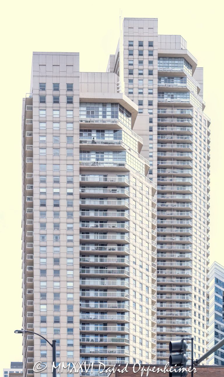Grand Plaza Apartments at 540 North State Street in Chicago, Illinois, located in the River North neighborhood near Grand Avenue and State Street. Contemporary residential high-rise architecture featuring dual apartment towers above a mixed-use podium with retail and shared amenity space. The full-block development was built in 2003 and includes rental apartments in the east tower and condominium residences in the west tower – © 2026 David Oppenheimer – Performance Impressions photography archives https://performanceimpressions.com Grand Plaza, Grand Plaza Apartments, Grand Plaza Chicago, Grand Plaza I, Grand Plaza East Tower, The Residences at Grand Plaza, Grand Plaza West Tower, 540 North State, 540 North State Street, 540 N State, North State Street, State Street, Grand Avenue, River North, Chicago, Chicago Illinois, Illinois, United States, 60654, Downtown Chicago, Chicago Loop, Near North Side, architecture, Chicago architecture, architectural photography, facade, building exterior, exterior, residential architecture, modern architecture, contemporary architecture, urban architecture, apartment towers, apartment tower, apartment building, rental apartments, luxury apartments, condominium tower, condominium building, condo tower, condo building, residential towers, residential tower, residential building, dual towers, two towers, high-rise, skyscraper, building, tower, glass tower, glass building, glass facade, balconies, balcony, podium, mixed-use building, mixed-use development, retail space, amenity space, residential real estate, apartment real estate, condominium real estate, Chicago real estate, real estate, downtown apartments, River North apartments, Chicago apartments, luxury rentals, urban living, city living, commercial architecture, downtown, urban, iconic building, American architecture, Illinois architecture, daylight, Loewenberg Associates, Loewenberg + Associates, OWP&P Architects, Magellan Development Group, Draper and Kramer, commercial photography, commercial imagery, image licensing, licensing, photography licensing, art, print, fine art, David Oppenheimer, vertical, 1-15156784411