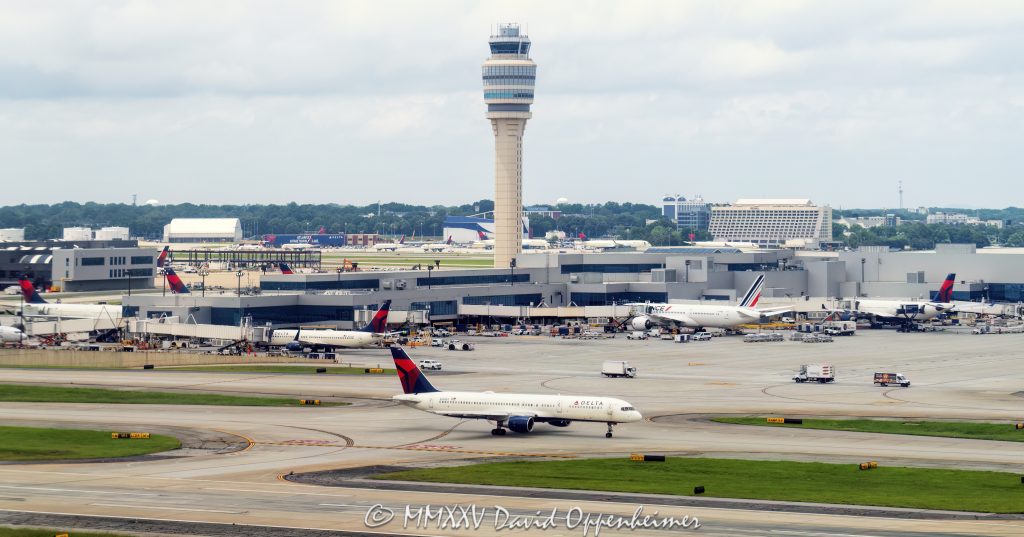 Hartsfield-Jackson Atlanta International Airport Air Traffic Control Tower Hartsfield-Jackson Atlanta International Airport air traffic control tower and Delta Air Lines Concourse F in Atlanta, Georgia - © 2025 David Oppenheimer - Performance Impressions aviation photography archives - https://performanceimpressions.com air traffic control, ATC, ATC towers, control tower, tower, ATL, Hartsfield-Jackson Atlanta International Airport, Hartsfield-Jackson, Delta, Delta Air Lines, DAL stock, DAL, KATL, Concourse F, International Terminal, tarmac, concourse, airspace, aviation, aircraft, guidance, air traffic, transportation, airport, airport traffic, radar, ground control, GMC, approach control, approach, terminal, route, control, collision avoidance, weather, runway, navigation, jets, planes, airlines, IFR, Atlanta, Georgia, Clayton County, David Oppenheimer, color, horizontal, United States, 1-14977862771