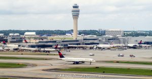 Hartsfield-Jackson Atlanta International Airport air traffic control tower and Delta Air Lines Concourse F in Atlanta, Georgia - © 2025 David Oppenheimer - Performance Impressions aviation photography archives - https://performanceimpressions.com air traffic control, ATC, ATC towers, control tower, tower, ATL, Hartsfield-Jackson Atlanta International Airport, Hartsfield-Jackson, Delta, Delta Air Lines, DAL stock, DAL, KATL, Concourse F, International Terminal, tarmac, concourse, airspace, aviation, aircraft, guidance, air traffic, transportation, airport, airport traffic, radar, ground control, GMC, approach control, approach, terminal, route, control, collision avoidance, weather, runway, navigation, jets, planes, airlines, IFR, Atlanta, Georgia, Clayton County, David Oppenheimer, color, horizontal, United States, 1-14977862771