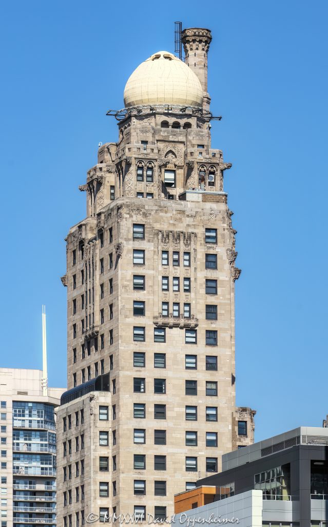 InterContinental Chicago Magnificent Mile by IHG at 505 North Michigan Avenue in Chicago, Illinois, located on the Magnificent Mile near the Chicago River and Tribune Tower. Historic hotel architecture in the former Medinah Athletic Club building, designed by Walter W. Ahlschlager and known for its ornate upper tower, pale stone facade, decorative details, and domed roofline. This vertical close-up highlights the landmark tower against a soft overcast sky – © 2026 David Oppenheimer – Performance Impressions photography archives https://performanceimpressions.com InterContinental Chicago Magnificent Mile by IHG, InterContinental Chicago Magnificent Mile, InterContinental Chicago, InterContinental Hotels, IHG, IHG Hotels, IHG Hotels & Resorts, IHG Hotels and Resorts, InterContinental Hotels Group, IHG One Rewards, IHG stock, Medinah Athletic Club, Medinah Club, 505 North Michigan, 505 North Michigan Avenue, 505 N Michigan, North Michigan Avenue, Michigan Avenue, Magnificent Mile, Chicago, Chicago Illinois, Illinois, United States, 60611, Downtown Chicago, Near North Side, Streeterville, Chicago Loop, Chicago River, Tribune Tower, architecture, Chicago architecture, architectural photography, facade, building exterior, exterior, historic architecture, hotel architecture, hospitality architecture, commercial architecture, Art Deco architecture, Moorish Revival, terra cotta, stone facade, pale facade, ornate facade, decorative facade, tower detail, upper tower, dome, domed roof, roofline, historic hotel, hotel building, luxury hotel, downtown hotel, Chicago hotel, Magnificent Mile hotel, high-rise, skyscraper, building, tower, commercial real estate, hotel real estate, real estate, landmark building, historic building, American architecture, Illinois architecture, white building, overcast, cloudy sky, soft light, daylight, urban architecture, downtown, urban, travel, tourism, Walter W Ahlschlager, Walter Ahlschlager, Strategic Hotels, commercial photography, commercial imagery, image licensing, licensing, photography licensing, art, print, fine art, David Oppenheimer, vertical, 1-15156784411