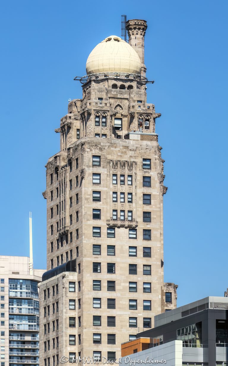 InterContinental Chicago Magnificent Mile by IHG at 505 North Michigan Avenue in Chicago, Illinois, located on the Magnificent Mile near the Chicago River and Tribune Tower. Historic hotel architecture in the former Medinah Athletic Club building, designed by Walter W. Ahlschlager and known for its ornate upper tower, pale stone facade, decorative details, and domed roofline. This vertical close-up highlights the landmark tower against a soft overcast sky – © 2026 David Oppenheimer – Performance Impressions photography archives https://performanceimpressions.com InterContinental Chicago Magnificent Mile by IHG, InterContinental Chicago Magnificent Mile, InterContinental Chicago, InterContinental Hotels, IHG, IHG Hotels, IHG Hotels & Resorts, IHG Hotels and Resorts, InterContinental Hotels Group, IHG One Rewards, IHG stock, Medinah Athletic Club, Medinah Club, 505 North Michigan, 505 North Michigan Avenue, 505 N Michigan, North Michigan Avenue, Michigan Avenue, Magnificent Mile, Chicago, Chicago Illinois, Illinois, United States, 60611, Downtown Chicago, Near North Side, Streeterville, Chicago Loop, Chicago River, Tribune Tower, architecture, Chicago architecture, architectural photography, facade, building exterior, exterior, historic architecture, hotel architecture, hospitality architecture, commercial architecture, Art Deco architecture, Moorish Revival, terra cotta, stone facade, pale facade, ornate facade, decorative facade, tower detail, upper tower, dome, domed roof, roofline, historic hotel, hotel building, luxury hotel, downtown hotel, Chicago hotel, Magnificent Mile hotel, high-rise, skyscraper, building, tower, commercial real estate, hotel real estate, real estate, landmark building, historic building, American architecture, Illinois architecture, white building, overcast, cloudy sky, soft light, daylight, urban architecture, downtown, urban, travel, tourism, Walter W Ahlschlager, Walter Ahlschlager, Strategic Hotels, commercial photography, commercial imagery, image licensing, licensing, photography licensing, art, print, fine art, David Oppenheimer, vertical, 1-15156784411