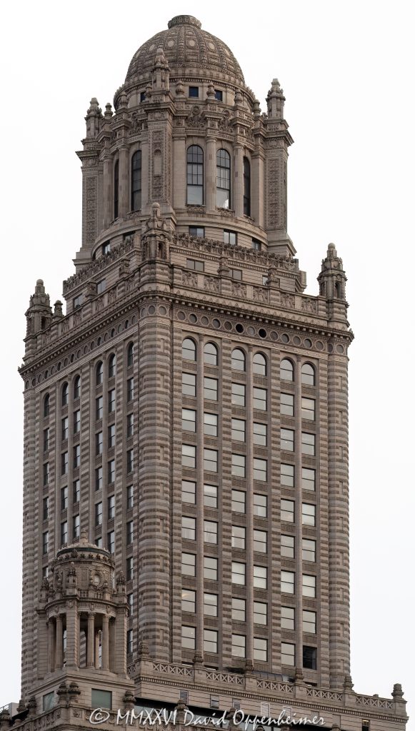 Jewelers Building at 35 East Wacker Drive in Chicago, Illinois, showing the ornate terra cotta exterior, upper tower, and historic skyscraper architecture in the Loop. Also known as 35 East Wacker, the building was formerly the Pure Oil Building and North American Life Building – © 2026 David Oppenheimer – Performance Impressions photography archives https://performanceimpressions.com Jewelers Building, 35 East Wacker, 35 East Wacker Drive, 35 E Wacker Dr, Jewelers Building Chicago, 35 East Wacker Chicago, Pure Oil Building, North American Life Building, North American Life Insurance Building, Chicago Loop, Loop Chicago, East Wacker Drive, Wacker Drive, Chicago architecture, Chicago skyscraper, historic skyscraper, terra cotta, ornate exterior, upper tower, building exterior, exterior, facade, historic architecture, classical revival architecture, neoclassical architecture, Chicago Landmark, downtown Chicago, Cook County, Illinois, Joachim Giaver, Frederick P Dinkelberg, Thielbar and Fugard, high rise, office building, commercial building, architecture, building, skyscraper, landmark, urban architecture, city architecture, architectural detail, windows, decorative masonry, ornamental detail, stonework, vertical architecture, Midwest, United States, 60601, Licensing, image licensing, commercial imagery, photography licensing, art, print, fine art, commercial photography, David Oppenheimer, vertical, 1-15213827141