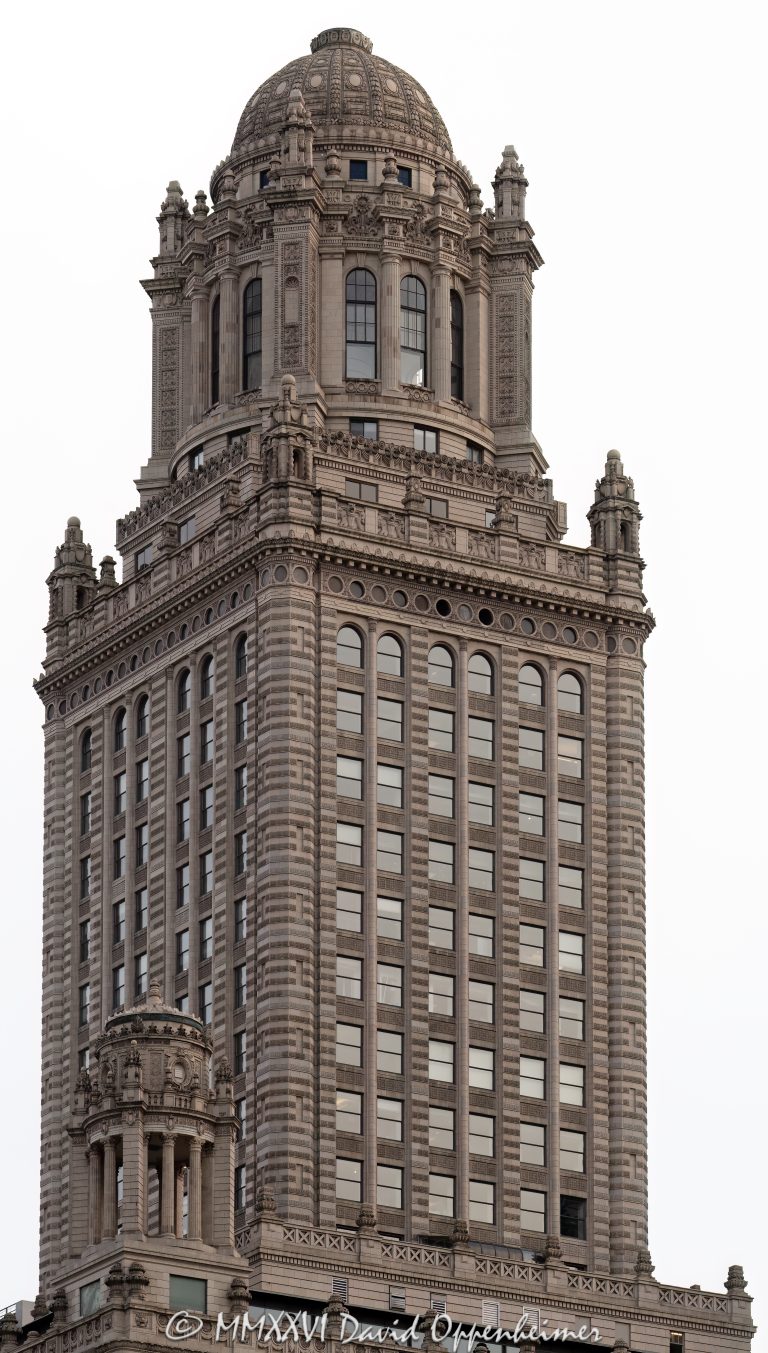 Jewelers Building at 35 East Wacker Drive in Chicago, Illinois, showing the ornate terra cotta exterior, upper tower, and historic skyscraper architecture in the Loop. Also known as 35 East Wacker, the building was formerly the Pure Oil Building and North American Life Building – © 2026 David Oppenheimer – Performance Impressions photography archives https://performanceimpressions.com Jewelers Building, 35 East Wacker, 35 East Wacker Drive, 35 E Wacker Dr, Jewelers Building Chicago, 35 East Wacker Chicago, Pure Oil Building, North American Life Building, North American Life Insurance Building, Chicago Loop, Loop Chicago, East Wacker Drive, Wacker Drive, Chicago architecture, Chicago skyscraper, historic skyscraper, terra cotta, ornate exterior, upper tower, building exterior, exterior, facade, historic architecture, classical revival architecture, neoclassical architecture, Chicago Landmark, downtown Chicago, Cook County, Illinois, Joachim Giaver, Frederick P Dinkelberg, Thielbar and Fugard, high rise, office building, commercial building, architecture, building, skyscraper, landmark, urban architecture, city architecture, architectural detail, windows, decorative masonry, ornamental detail, stonework, vertical architecture, Midwest, United States, 60601, Licensing, image licensing, commercial imagery, photography licensing, art, print, fine art, commercial photography, David Oppenheimer, vertical, 1-15213827141