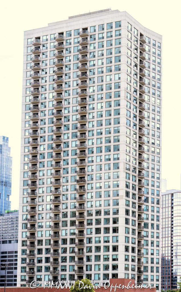 Kinzie Park Tower condominium high-rise at 501 North Clinton Street in Chicago, Illinois, showing the modern residential tower exterior and vertical architecture near the Chicago River in downtown Chicago – © 2026 David Oppenheimer – Performance Impressions photography archives https://performanceimpressions.com Kinzie Park Tower, 501 North Clinton Street, 501 N Clinton St, Kinzie Park Tower Chicago, Kinzie Park Chicago, Kinzie Park condominiums, Kinzie Park condos, 501 North Clinton, 501 N Clinton, Chicago condominium tower, Chicago condo tower, Chicago residential tower, Fulton River District, Fulton River District Chicago, River North, River North Chicago, Near North Side, downtown Chicago, Chicago River, North Branch Chicago River, Clinton Street, North Clinton Street, Grand Avenue, building exterior, exterior, facade, architecture, building, tower, residential tower, condominium tower, condo tower, high rise, residential high rise, modern high rise, modern architecture, residential architecture, urban architecture, Chicago architecture, balconies, balcony facade, glass balconies, glass facade, curved facade, rounded corners, windows, walls of windows, concrete, modern residential building, luxury condominiums, residential development, gated community, riverfront community, riverfront residential, private residential community, townhomes, midrise, high-rise condominium tower, 208 units, 34 floors, completed 2001, downtown residential, urban residential, city living, Chicago real estate, Chicago condos, Chicago apartments, condo building, apartment building, multifamily housing, vertical architecture, skyline building, cityscape, street view, ground photo, ground photography, Cook County, Illinois, Midwest, United States, 60654, Licensing, image licensing, commercial imagery, photography licensing, art, print, fine art, commercial photography, David Oppenheimer, vertical, 1-15156784411