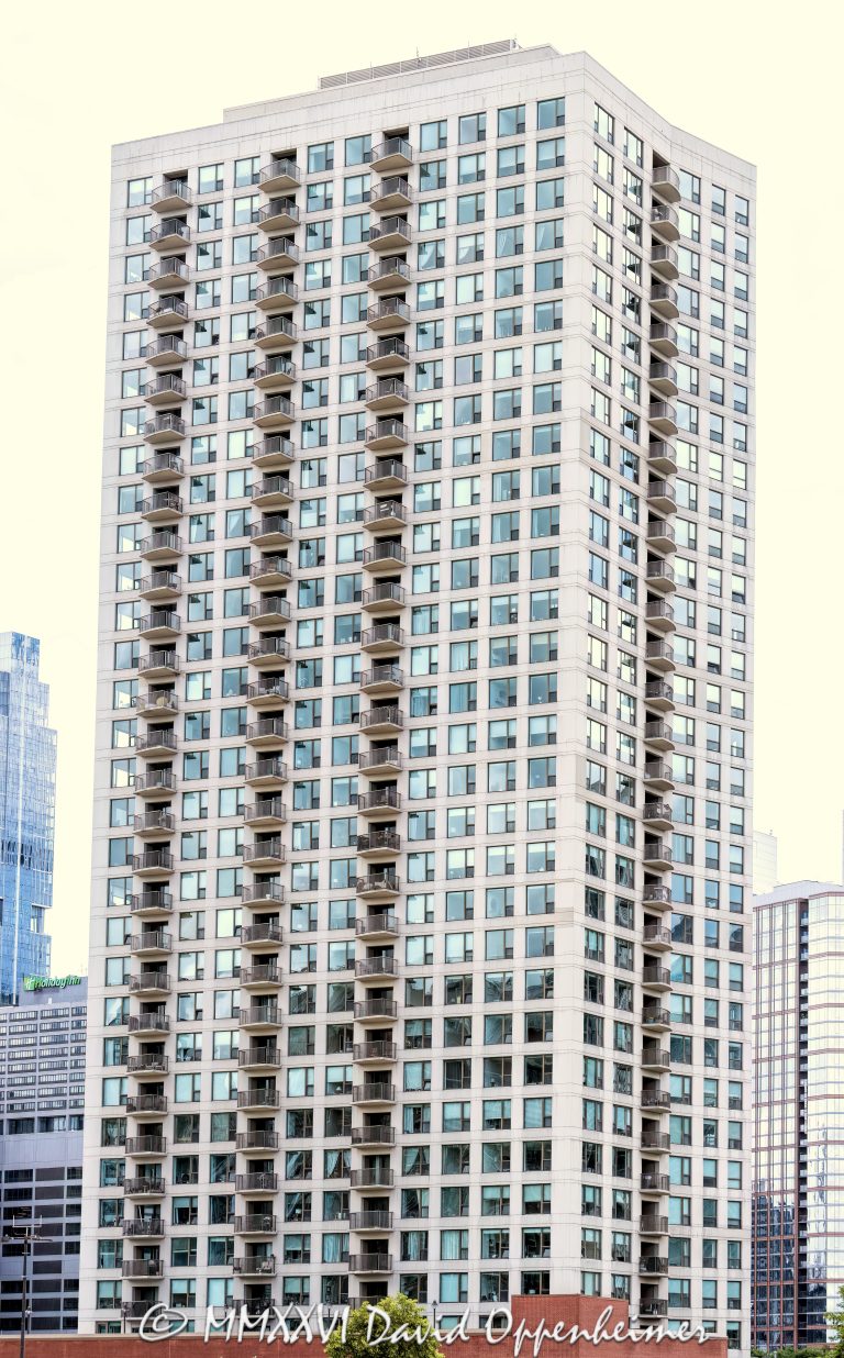 Kinzie Park Tower condominium high-rise at 501 North Clinton Street in Chicago, Illinois, showing the modern residential tower exterior and vertical architecture near the Chicago River in downtown Chicago – © 2026 David Oppenheimer – Performance Impressions photography archives https://performanceimpressions.com Kinzie Park Tower, 501 North Clinton Street, 501 N Clinton St, Kinzie Park Tower Chicago, Kinzie Park Chicago, Kinzie Park condominiums, Kinzie Park condos, 501 North Clinton, 501 N Clinton, Chicago condominium tower, Chicago condo tower, Chicago residential tower, Fulton River District, Fulton River District Chicago, River North, River North Chicago, Near North Side, downtown Chicago, Chicago River, North Branch Chicago River, Clinton Street, North Clinton Street, Grand Avenue, building exterior, exterior, facade, architecture, building, tower, residential tower, condominium tower, condo tower, high rise, residential high rise, modern high rise, modern architecture, residential architecture, urban architecture, Chicago architecture, balconies, balcony facade, glass balconies, glass facade, curved facade, rounded corners, windows, walls of windows, concrete, modern residential building, luxury condominiums, residential development, gated community, riverfront community, riverfront residential, private residential community, townhomes, midrise, high-rise condominium tower, 208 units, 34 floors, completed 2001, downtown residential, urban residential, city living, Chicago real estate, Chicago condos, Chicago apartments, condo building, apartment building, multifamily housing, vertical architecture, skyline building, cityscape, street view, ground photo, ground photography, Cook County, Illinois, Midwest, United States, 60654, Licensing, image licensing, commercial imagery, photography licensing, art, print, fine art, commercial photography, David Oppenheimer, vertical, 1-15156784411