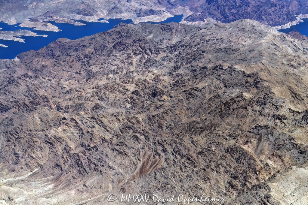 Lake Mead and Canyon Ridge in the Black Mountains in Arizona Aerial View Lake Mead and Canyon Ridge in the Black Mountains in Arizona, aerial view – © 2025 David Oppenheimer – Performance Impressions aerial photography archives - https://performanceimpressions.com Lake Mead, Lake Mead aerial, Canyon Ridge, Black Mountains, Arizona, 86443, Bearing Point, Rotary Cove, Bighorn Cove, Canyon Point, Canyon Point Cove, Rufus Cove, Sandy Cove, Auxiliary Point, Bearing Peak, Indian Canyon Cove, Indian Canyon, Indian Pass, rocks, rocky, mountain, Meadview, Sidewinder Cove, Nevada, border, Mohave County, Lake Mead National Recreation Area, aerial, desert, lake, arid, remote, Mt. Wilson, Wilson Ridge, Clark County, aerial photographer, aerial photography, United States, horizontal, colorful, color, American west, 1-14993092111