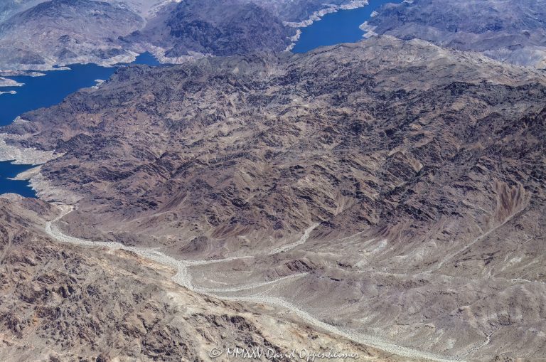 Lake Mead and Canyon Ridge in the Black Mountains in Arizona, aerial view – © 2025 David Oppenheimer – Performance Impressions aerial photography archives - https://performanceimpressions.com Lake Mead, Lake Mead aerial, Canyon Ridge, Black Mountains, Arizona, 86443, Bearing Point, Rotary Cove, Bighorn Cove, Canyon Point, Canyon Point Cove, Rufus Cove, Sandy Cove, Auxiliary Point, Bearing Peak, Indian Canyon Cove, Indian Canyon, Indian Pass, rocks, rocky, mountain, Meadview, Sidewinder Cove, Nevada, border, Mohave County, Lake Mead National Recreation Area, aerial, desert, lake, arid, remote, Mt. Wilson, Wilson Ridge, Clark County, aerial photographer, aerial photography, United States, horizontal, colorful, color, American west, 1-14993092111