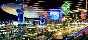 Las Vegas city lights reflected across architecture and glass—featuring Wynn, Resorts World, Overlook Lounge, and the Cloud canopy at Fashion Show Mall. A layered, nighttime composition of color and structure in Las Vegas, Nevada - © 2025 David Oppenheimer - Performance Impressions photography archives - https://performanceimpressions.com Las Vegas Convention Center at 3150 Paradise Rd in Paradise, Nevada aerial view - © 2025 David Oppenheimer - Las Vegas, Vegas, Las Vegas at night, Las Vegas city lights, Las Vegas reflections, Las Vegas Strip, Las Vegas Strip architecture, Las Vegas night photography, night, night photo, nighttime, city lights, cityscape, reflection, reflections, abstract, abstract photography, urban reflections, urban photography, Wynn, bridge, Wynn Las Vegas, Resorts World Las Vegas, Hilton Resorts World, Overlook Lounge, Fashion Show Mall, mall, Fashion Show, shopping, vacation, escape, dream, Fashion Show Mall canopy, art, fine art, artwork, painting, Cloud canopy, saucer, resort architecture, casino lights, neon lights, architectural reflections, glass reflections, modern architecture, urban, casinos, facades, architecture, urban design, design, skyline, city light reflections, Nevada, Nevada photography, 89109, colorful, United States, horizontal, color, 1-14977862771