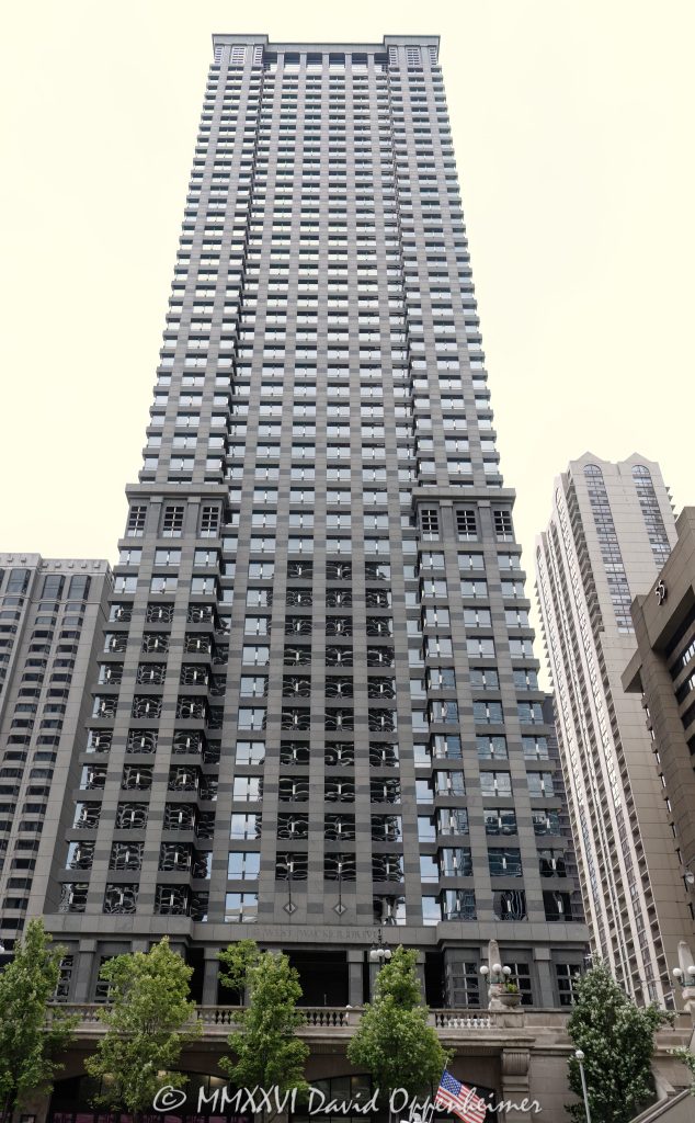 Leo Burnett Building at 35 West Wacker Drive rises above the Chicago River in the Loop, showing the postmodern office tower’s granite, glass, masonry, and stainless-steel facade. Designed by Roche Dinkeloo & Associates with Shaw & Associates and developed by The John Buck Company for Leo Burnett, the skyscraper is also widely known as 35 West Wacker – © 2026 David Oppenheimer – Performance Impressions photography archives https://performanceimpressions.com Leo Burnett Building 35 W Wacker Drive, Leo Burnett Building, 35 West Wacker, 35 West Wacker Drive, 35 W Wacker Drive, 35 W Wacker, Leo Burnett Building Chicago, 35 West Wacker Chicago, 35 W Wacker Chicago, Chicago Loop, Loop Chicago, downtown Chicago, Wacker Drive, West Wacker Drive, North Dearborn Street, Chicago River, Chicago Riverfront, Chicago Illinois, Chicago IL, 60601, facade, building exterior, exterior, tower facade, office tower, office building, commercial building, skyscraper, high rise, architecture, architectural photography, Chicago architecture, downtown Chicago architecture, corporate architecture, postmodern architecture, postmodern skyscraper, granite facade, glass facade, masonry facade, stainless steel facade, Chicago windows, Roche Dinkeloo, Roche Dinkeloo & Associates, Kevin Roche, John Dinkeloo, Kevin Roche John Dinkeloo and Associates, Shaw & Associates, The John Buck Company, Leo Burnett Worldwide, Leo Burnett Company, Leo Burnett advertising, Publicis Groupe, Publicis, advertising agency, Chicago advertising agency, corporate headquarters, Class A office building, Illinois architecture, United States, Licensing, image licensing, commercial imagery, photography licensing, art, print, fine art, commercial photography, David Oppenheimer, vertical, 1-15156784411