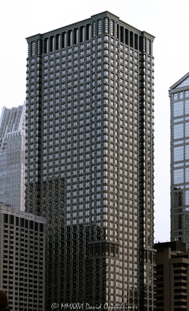 Leo Burnett Building at 35 West Wacker Drive rises above the Chicago River in the Loop, showing the postmodern office tower’s granite, glass, masonry, and stainless-steel facade. Designed by Roche Dinkeloo & Associates with Shaw & Associates and developed by The John Buck Company for Leo Burnett, the skyscraper is also widely known as 35 West Wacker – © 2026 David Oppenheimer – Performance Impressions photography archives https://performanceimpressions.com Leo Burnett Building 35 W Wacker Drive, Leo Burnett Building, 35 West Wacker, 35 West Wacker Drive, 35 W Wacker Drive, 35 W Wacker, Leo Burnett Building Chicago, 35 West Wacker Chicago, 35 W Wacker Chicago, Chicago Loop, Loop Chicago, downtown Chicago, Wacker Drive, West Wacker Drive, North Dearborn Street, Chicago River, Chicago Riverfront, Chicago Illinois, Chicago IL, 60601, facade, building exterior, exterior, tower facade, office tower, office building, commercial building, skyscraper, high rise, architecture, architectural photography, Chicago architecture, downtown Chicago architecture, corporate architecture, postmodern architecture, postmodern skyscraper, granite facade, glass facade, masonry facade, stainless steel facade, Chicago windows, Roche Dinkeloo, Roche Dinkeloo & Associates, Kevin Roche, John Dinkeloo, Kevin Roche John Dinkeloo and Associates, Shaw & Associates, The John Buck Company, Leo Burnett Worldwide, Leo Burnett Company, Leo Burnett advertising, Publicis Groupe, Publicis, advertising agency, Chicago advertising agency, corporate headquarters, Class A office building, Illinois architecture, United States, Licensing, image licensing, commercial imagery, photography licensing, art, print, fine art, commercial photography, David Oppenheimer, vertical, 1-15213827141