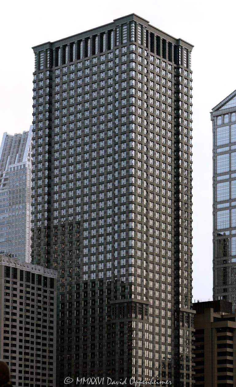 Leo Burnett Building at 35 West Wacker Drive rises above the Chicago River in the Loop, showing the postmodern office tower’s granite, glass, masonry, and stainless-steel facade. Designed by Roche Dinkeloo & Associates with Shaw & Associates and developed by The John Buck Company for Leo Burnett, the skyscraper is also widely known as 35 West Wacker – © 2026 David Oppenheimer – Performance Impressions photography archives https://performanceimpressions.com Leo Burnett Building 35 W Wacker Drive, Leo Burnett Building, 35 West Wacker, 35 West Wacker Drive, 35 W Wacker Drive, 35 W Wacker, Leo Burnett Building Chicago, 35 West Wacker Chicago, 35 W Wacker Chicago, Chicago Loop, Loop Chicago, downtown Chicago, Wacker Drive, West Wacker Drive, North Dearborn Street, Chicago River, Chicago Riverfront, Chicago Illinois, Chicago IL, 60601, facade, building exterior, exterior, tower facade, office tower, office building, commercial building, skyscraper, high rise, architecture, architectural photography, Chicago architecture, downtown Chicago architecture, corporate architecture, postmodern architecture, postmodern skyscraper, granite facade, glass facade, masonry facade, stainless steel facade, Chicago windows, Roche Dinkeloo, Roche Dinkeloo & Associates, Kevin Roche, John Dinkeloo, Kevin Roche John Dinkeloo and Associates, Shaw & Associates, The John Buck Company, Leo Burnett Worldwide, Leo Burnett Company, Leo Burnett advertising, Publicis Groupe, Publicis, advertising agency, Chicago advertising agency, corporate headquarters, Class A office building, Illinois architecture, United States, Licensing, image licensing, commercial imagery, photography licensing, art, print, fine art, commercial photography, David Oppenheimer, vertical, 1-15213827141