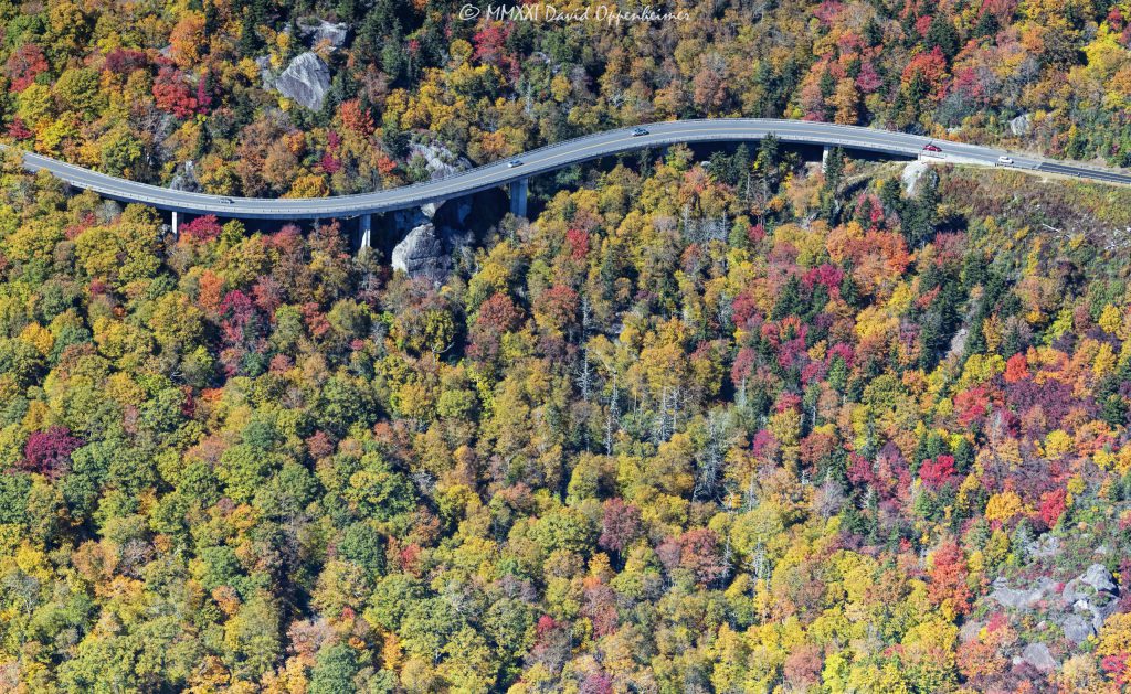 Linn Cove Viaduct on the Blue Ridge Parkway at the Base of Grandfather Mountain with Peak Autumn Colors Aerial View