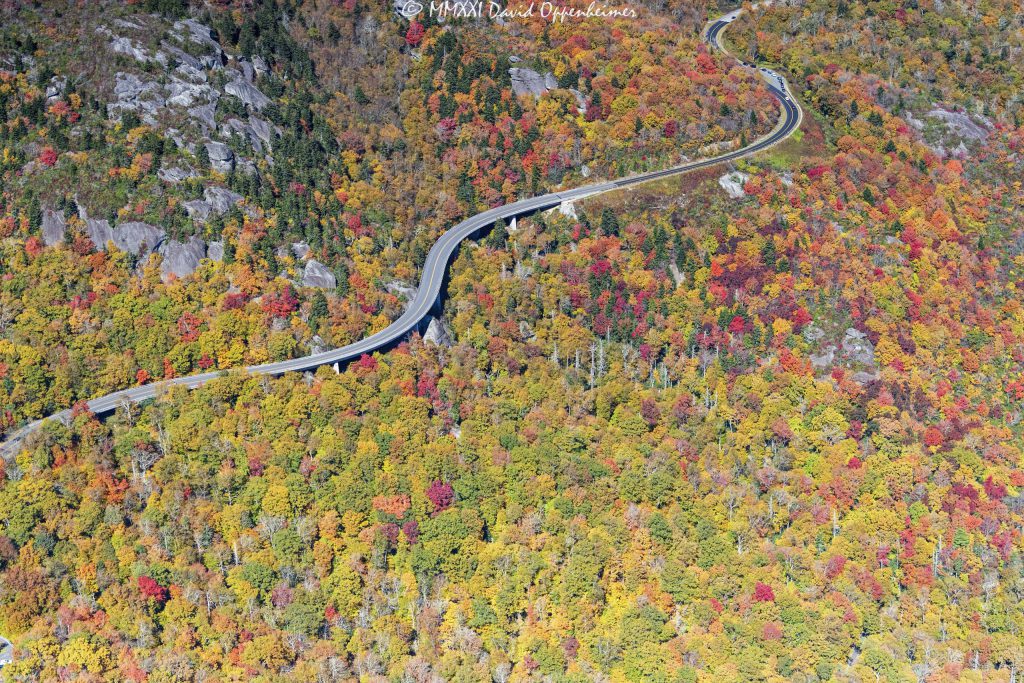 Linn Cove Viaduct on the Blue Ridge Parkway at the Base of Grandfather Mountain with Peak Autumn Colors Aerial View