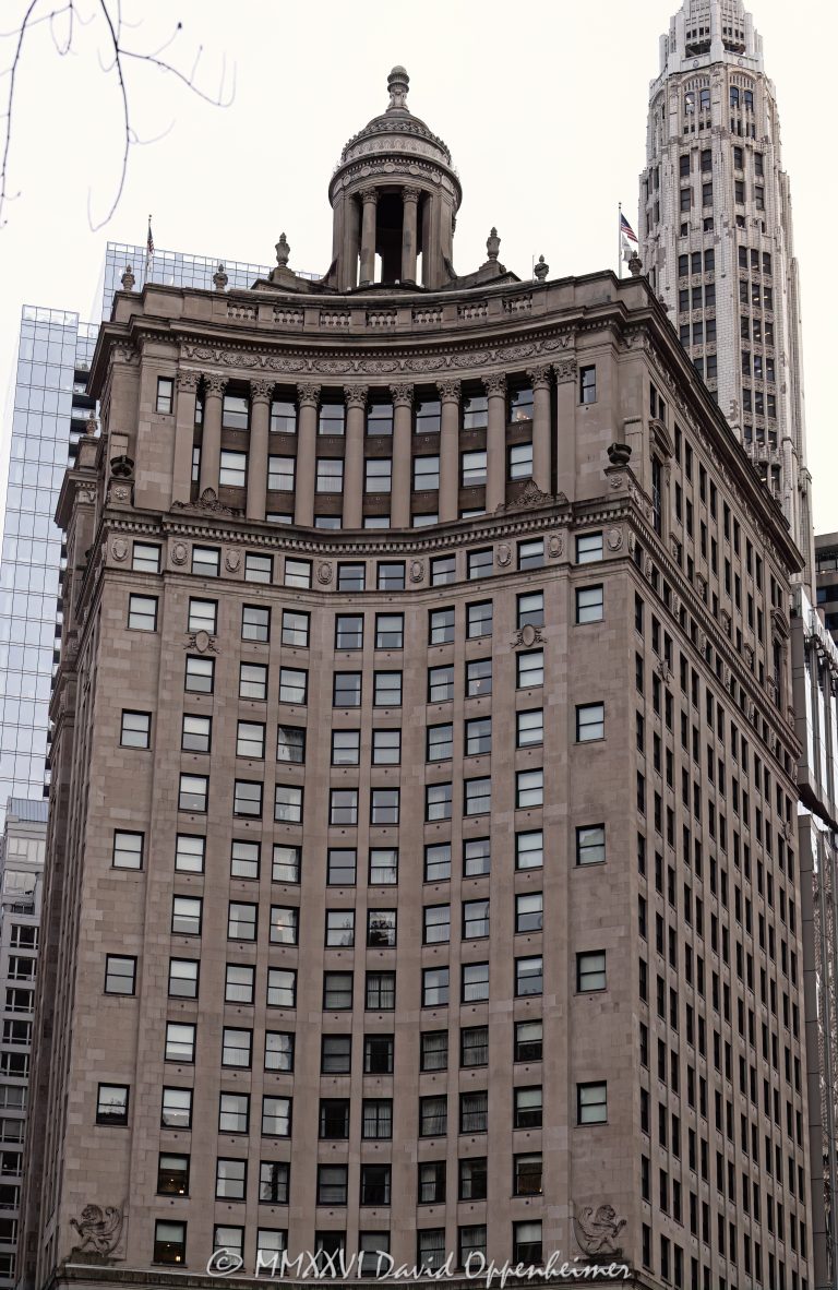LondonHouse Chicago, Curio Collection by Hilton, at 85 East Wacker Drive occupies the restored London Guarantee Building beside the Chicago River. Alfred S. Alschuler’s Beaux-Arts tower pairs an Indiana limestone facade, Corinthian colonnades and a domed cupola with a modern glass addition by Goettsch Partners, creating a distinctive luxury hotel at Michigan Avenue and Wacker Drive in Chicago, Illinois – © 2026 David Oppenheimer – Performance Impressions photography archives https://performanceimpressions.com LondonHouse Chicago Curio Collection by Hilton, LondonHouse Chicago, LondonHouse, LondonHouse Hotel, London House Chicago, London House Hotel, Curio Collection by Hilton, Curio Collection, Hilton, Hilton Honors, Hilton Worldwide Holdings, 85 East Wacker Drive, 85 E Wacker Drive, 85 E Wacker Dr, 360 North Michigan Avenue, 360 N Michigan Avenue, 360 N Michigan Ave, London Guarantee Building, London Guarantee & Accident Building, London Guarantee and Accident Building, London Guaranty & Accident Building, Stone Container Building, Crain Communications Building, London House jazz club, London House, East Wacker Drive, Wacker Drive, North Michigan Avenue, Michigan Avenue, Chicago River, Chicago Riverwalk, Riverwalk, riverfront, waterfront, Magnificent Mile, DuSable Bridge, Michigan Avenue Bridge, Michigan Wacker Historic District, Chicago Loop, Loop Chicago, downtown Chicago, Chicago, Chicago Illinois, Chicago IL, Illinois, 60601, facade, building exterior, exterior, hotel facade, limestone facade, Indiana limestone, stone facade, Beaux-Arts, Beaux-Arts architecture, classical architecture, Corinthian columns, colonnade, cupola, domed cupola, dome, historic facade, ornate facade, glass addition, glass tower, modern addition, adaptive reuse, hotel conversion, historic hotel, luxury hotel, boutique hotel, downtown hotel, Chicago hotel, riverfront hotel, Michigan Avenue hotel, hotel, hospitality, travel, tourism, rooftop bar, LH Rooftop, LondonHouse rooftop, building, tower, high rise, skyscraper, landmark building, historic building, Chicago Landmark, Fort Dearborn, jazz history, jazz club, WLS Radio, Paul Harvey, architecture, architectural photography, Chicago architecture, hotel architecture, historic architecture, commercial architecture, Alfred S Alschuler, Alfred Alschuler, Goettsch Partners, Oxford Capital Group, Oxford Hotels & Resorts, London Guarantee and Accident Company, real estate, Chicago real estate, hotel real estate, commercial real estate, riverfront real estate, Illinois architecture, United States, licensing, image licensing, commercial imagery, photography licensing, art, print, fine art, commercial photography, David Oppenheimer, vertical, 1-15213827141