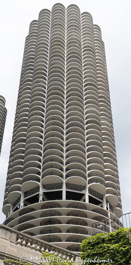 Marina City Condominiums in Chicago, with the curving concrete facade and repeating cantilevered balconies of Bertrand Goldberg’s residential towers at 300 North State Street in River North. Also known as Marina Towers and the Corn Cob Towers, the landmark mixed-use complex is one of Chicago’s most recognizable modernist architecture sites – © 2026 David Oppenheimer – Performance Impressions photography archives https://performanceimpressions.com Marina City 300 N State St, Marina City Condominiums, Marina City balconies, Marina City balconies Chicago, Marina City condominiums Chicago, Marina Towers balconies, Marina Towers Condominium Association, Marina Towers Condominiums, Marina Towers, 300 N State Street, 300 North State Street, Marina City Chicago, Marina City Chicago IL 60654, Chicago Marina City, Corn Cob Towers, Corncob Towers, Marina City Towers, River North, River North Chicago, Near North Side, downtown Chicago, Chicago River, State Street Chicago, North State Street, Chicago landmark, Chicago architecture, Chicago condominiums, Chicago residential towers, Chicago high rise, Chicago high-rise, facade, building exterior, exterior, architecture, building, tower, condominium, condominiums, residential building, residential tower, mixed-use complex, modernist architecture, mid-century modern architecture, concrete architecture, reinforced concrete, concrete facade, curved facade, cylindrical tower, circular tower, cantilevered balconies, balcony facade, repeating balconies, Bertrand Goldberg, Bertrand Goldberg Associates, Severud-Elstad-Krueger, Marina City Building Corporation, Building Service Employees International Union, House of Blues Chicago, Hotel Chicago, Marina City Riverfront, Chicago urban architecture, Illinois architecture, United States, Licensing, image licensing, commercial imagery, photography licensing, art, print, fine art, commercial photography, David Oppenheimer, vertical, 1-15156784411