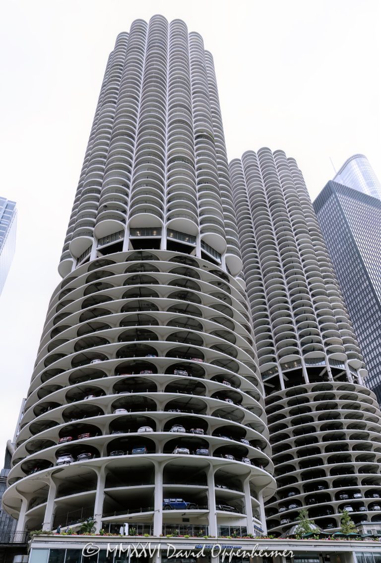 Marina City Condominiums in Chicago, with the curving concrete facade and repeating cantilevered balconies of Bertrand Goldberg’s residential towers at 300 North State Street in River North. Also known as Marina Towers and the Corn Cob Towers, the landmark mixed-use complex is one of Chicago’s most recognizable modernist architecture sites – © 2026 David Oppenheimer – Performance Impressions photography archives https://performanceimpressions.com Marina City 300 N State St, Marina City Condominiums, Marina City balconies, Marina City balconies Chicago, Marina City condominiums Chicago, Marina Towers balconies, Marina Towers Condominium Association, Marina Towers Condominiums, Marina Towers, 300 N State Street, 300 North State Street, Marina City Chicago, Marina City Chicago IL 60654, Chicago Marina City, Corn Cob Towers, Corncob Towers, Marina City Towers, River North, River North Chicago, Near North Side, downtown Chicago, Chicago River, State Street Chicago, North State Street, Chicago landmark, Chicago architecture, Chicago condominiums, Chicago residential towers, Chicago high rise, Chicago high-rise, facade, building exterior, exterior, architecture, building, tower, condominium, condominiums, residential building, residential tower, mixed-use complex, modernist architecture, mid-century modern architecture, concrete architecture, reinforced concrete, concrete facade, curved facade, cylindrical tower, circular tower, cantilevered balconies, balcony facade, repeating balconies, Bertrand Goldberg, Bertrand Goldberg Associates, Severud-Elstad-Krueger, Marina City Building Corporation, Building Service Employees International Union, House of Blues Chicago, Hotel Chicago, Marina City Riverfront, Chicago urban architecture, Illinois architecture, United States, Licensing, image licensing, commercial imagery, photography licensing, art, print, fine art, commercial photography, David Oppenheimer, vertical, 1-15156784411