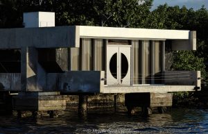 The Roman E. Moreth House Mid-century Modern signature style architectural wonder designed by William Morgan that overhangs above the New River at 3000 NE 19th St in the Dolphin Isles neighborhood in Fort Lauderdale, Florida - © 2024 David Oppenheimer - Performance Impressions photography archives - https://performanceimpressions.com Moreth House, Moreth, The Roman E. Moreth House, Roman E. Moreth House, house, Filthy Customs, Roman Moreth III, Roman Moreth, Roman E. Moreth Jr, Filthy Customs Corporation, William Morgan, New River, The Moreth House, signature style, windows, modern, tropical architecture, overhang, above, 3000 NE 19th St, design, Mid-century, Mid-century Modern, concrete, cement, deck, patio, historic, Dolphin Isles, architect, Fort Lauderdale, architecture, real estate, Fort Lauderdale real estate, estate, grounds, property, Florida, 33305, facade, waterfront, luxury real estate, dock, dockage, Intracoastal, Intracoastal Waterway, prestigious, trophy property, South Florida, Broward County, courtyard, exclusive, Art Deco, sunset, palm trees, tropical, seawall, David Oppenheimer, color, horizontal, United States, VAu 1-530-124, 1-13553735171,