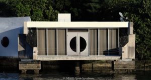 The Roman E. Moreth House Mid-century Modern signature style architectural wonder designed by William Morgan that overhangs above the New River at 3000 NE 19th St in the Dolphin Isles neighborhood in Fort Lauderdale, Florida - © 2024 David Oppenheimer - Performance Impressions photography archives - https://performanceimpressions.com Moreth House, Moreth, The Roman E. Moreth House, Roman E. Moreth House, house, Filthy Customs, Roman Moreth III, Roman Moreth, Roman E. Moreth Jr, Filthy Customs Corporation, William Morgan, New River, The Moreth House, signature style, windows, modern, tropical architecture, overhang, above, 3000 NE 19th St, design, Mid-century, Mid-century Modern, concrete, cement, deck, patio, historic, Dolphin Isles, architect, Fort Lauderdale, architecture, real estate, Fort Lauderdale real estate, estate, grounds, property, Florida, 33305, facade, waterfront, luxury real estate, dock, dockage, Intracoastal, Intracoastal Waterway, prestigious, trophy property, South Florida, Broward County, courtyard, exclusive, Art Deco, sunset, palm trees, tropical, seawall, David Oppenheimer, color, horizontal, United States, VAu 1-530-124, 1-13553735171,