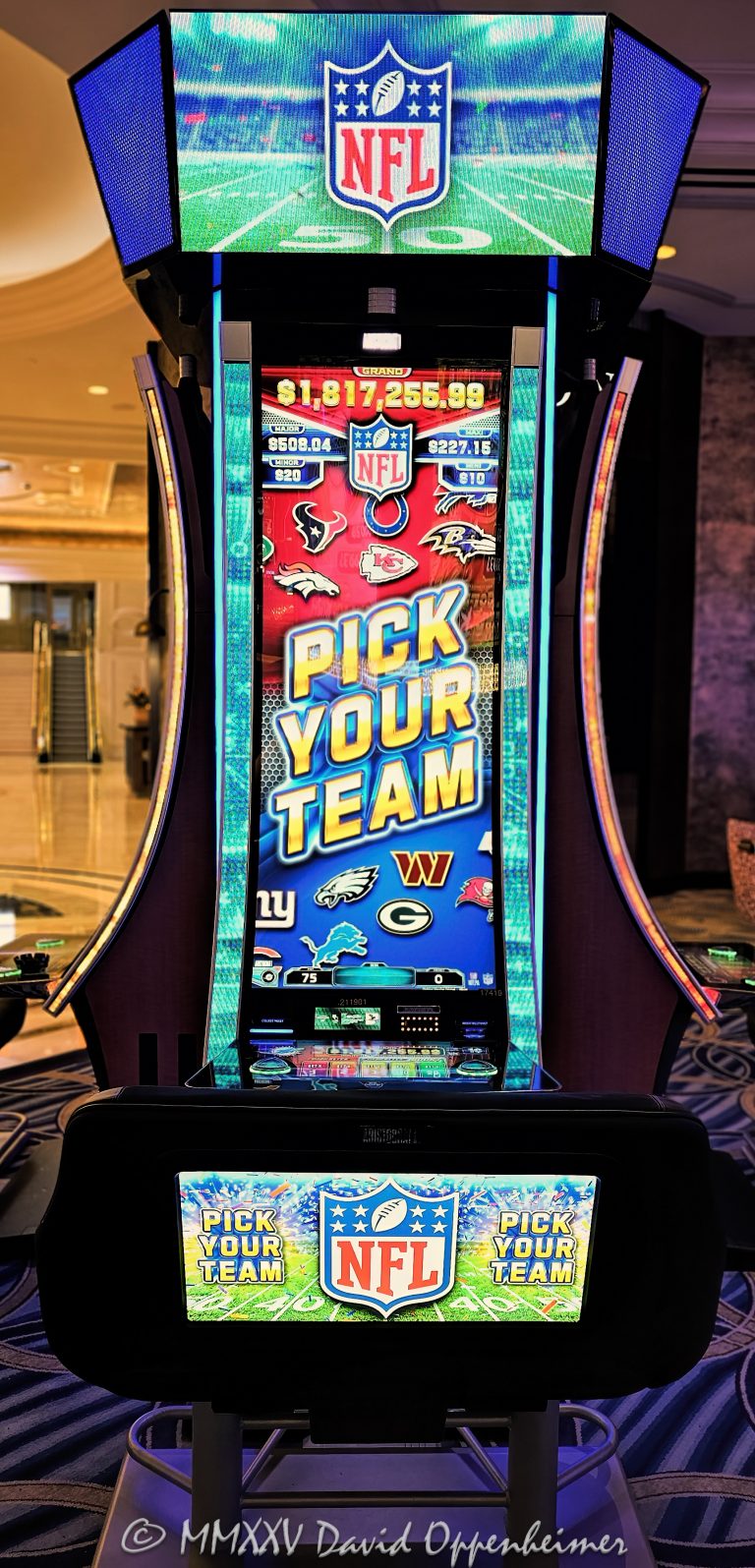 NFL Slots Super Bowl Jackpots slot machine at The Venetian Casino by Aristocrat Technologies in Las Vegas, Nevada - © 2025 David Oppenheimer - Performance Impressions casino photography archives - https://performanceimpressions.com NFL Slots, NFL, Pick Your Team, National Football League, slot machine, Aristocrat Technologies, Aristocrat Gaming, Super Bowl Jackpots, Super Bowl, The Venetian, gaming, casino, Las Vegas, Nevada, slots, odds, win, gambling, wager, bet, luck, jackpot, gamble, quick spin, resort, American Gaming Association, Aristocrat Leisure Limited, ALL, AGA, 3355 S Las Vegas Blvd, 89109, bright, lights, colorful, United States, vertical, color, 1-14977862771