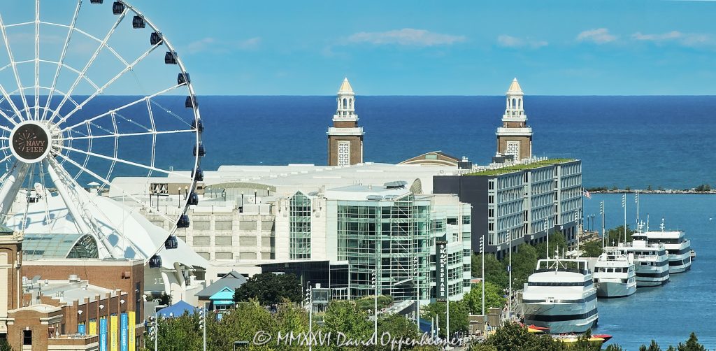 Navy Pier in Chicago, Illinois, on Lake Michigan on a summer day, with the Centennial Wheel, Sable Hotel, Chicago Children’s Museum and Chicago Shakespeare Theater visible across the landmark lakefront destination. Several large vessels are docked along Navy Pier’s South Dock, while the towers at the historic Aon Grand Ballroom mark the pier’s eastern end – © 2026 David Oppenheimer – Performance Impressions photography archives https://performanceimpressions.com Navy Pier, Navy Pier Chicago, Chicago Navy Pier, Chicago pier, Navy Pier view, Navy Pier lakefront, Navy Pier waterfront, Chicago lakefront, Chicago waterfront, Lake Michigan, Chicago, Illinois, pier, lakefront, waterfront, landmark, Chicago landmark, Chicago attraction, tourist attraction, Chicago tourism, Chicago travel, Chicago destination, Chicago postcard, postcard, postcard view, scenic Chicago, Chicago scenery, summer, Chicago summer, summer day, sunny, lake view, waterfront view, lakefront view, horizon, water, lake, Centennial Wheel, Navy Pier Centennial Wheel, Centennial Wheel Chicago, Navy Pier wheel, Chicago Ferris wheel, Ferris wheel, observation wheel, wheel, Pier Park, Chicago Children’s Museum, Childrens Museum, children’s museum, museum, Chicago museum, Family Pavilion, Chicago Shakespeare Theater, Chicago Shakespeare, Shakespeare Theater, theater, theatre, performing arts, Sable Hotel, Sable at Navy Pier, Sable Chicago, Sable, Sable at Navy Pier Chicago, Sable at Navy Pier Chicago Curio Collection by Hilton, Navy Pier hotel, Chicago hotel, waterfront hotel, lakefront hotel, boutique hotel, hotel, Curio Collection, Curio Collection by Hilton, Hilton, Hilton Hotels, Hilton Worldwide, Hilton Worldwide Holdings, HLT, NYSE HLT, Hilton stock, Maverick Hotels, Maverick Hotels & Restaurants, ACRON, ACRON Group, KOO, hotel architecture, Aon Grand Ballroom, Grand Ballroom, Navy Pier ballroom, ballroom, ballroom towers, east end, Navy Pier east end, Festival Hall, Offshore Rooftop, Offshore, South Dock, Navy Pier South Dock, dock, docks, docked vessels, docked ships, docked boats, vessels, vessel, ships, ship, boats, boat, passenger vessels, tour boats, cruise boats, Chicago cruises, lake cruises, Lake Michigan cruises, sailing, boating, maritime, nautical, Chicago boating, Chicago harbor, architecture, Navy Pier architecture, Chicago architecture, lakefront architecture, Streeterville, Streeterville Chicago, Near North Side, Grand Avenue, 600 East Grand Avenue, 600 E Grand Ave, 900 East Grand Avenue, 900 E Grand Ave, 60611, Navy Pier Inc, Navy Pier Incorporated, Municipal Pier, Municipal Pier No. 2, Charles Sumner Frost, Charles Frost, architect, Plan of Chicago, United States, USA, Navy Pier photography, Chicago photography, waterfront photography, lakefront photography, travel photography, tourism photography, editorial photography, landscape photography, cityscape photography, architectural photography, fine art photography, Chicago art, Navy Pier art, Chicago print, Navy Pier print, lakefront art, photographic print, fine art print, archival print, gallery print, collector print, wall art, office art, licensing, image licensing, commercial imagery, photography licensing, art, print, fine art, commercial photography, David Oppenheimer, Performance Impressions, Performance Impressions photography archives, horizontal, 1-15213827141