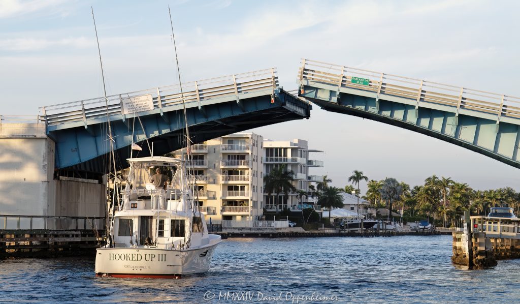 Oakland Park Boulevard Bridge drawbridge opening with the yacht Hooked Up III on the Intracoastal Waterway in Fort Lauderdale, Florida - © 2024 David Oppenheimer - Performance Impressions photography archives - https://performanceimpressions.com Oakland Park Boulevard Bridge, Oakland Bridge, drawbridge, bridge, Intracoastal, Intracoastal Waterway, Lauderdale Beach, Galt Mile, Coral Ridge, East Oakland, East Oakland Park Boulevard, double-leaf bascule, Fort Lauderdale, yachting, yacht, Hooked Up, Hooked Up III, boat, travel, vacation, fishing, fishing boat, deep sea fishing, opening, open, draw bridge, Ocean Alexander 90, Alexander 90, Ocean Alexander, isles, river, architecture, real estate, Fort Lauderdale real estate, property, Florida, 33308, engineering, logistics, waterway, waterfront, neighborhood, South Florida, Broward County, resort-style, sunset, palm trees, tropical, seawall, David Oppenheimer, color, horizontal, United States, VAu 1-530-124, 1-13553735171,