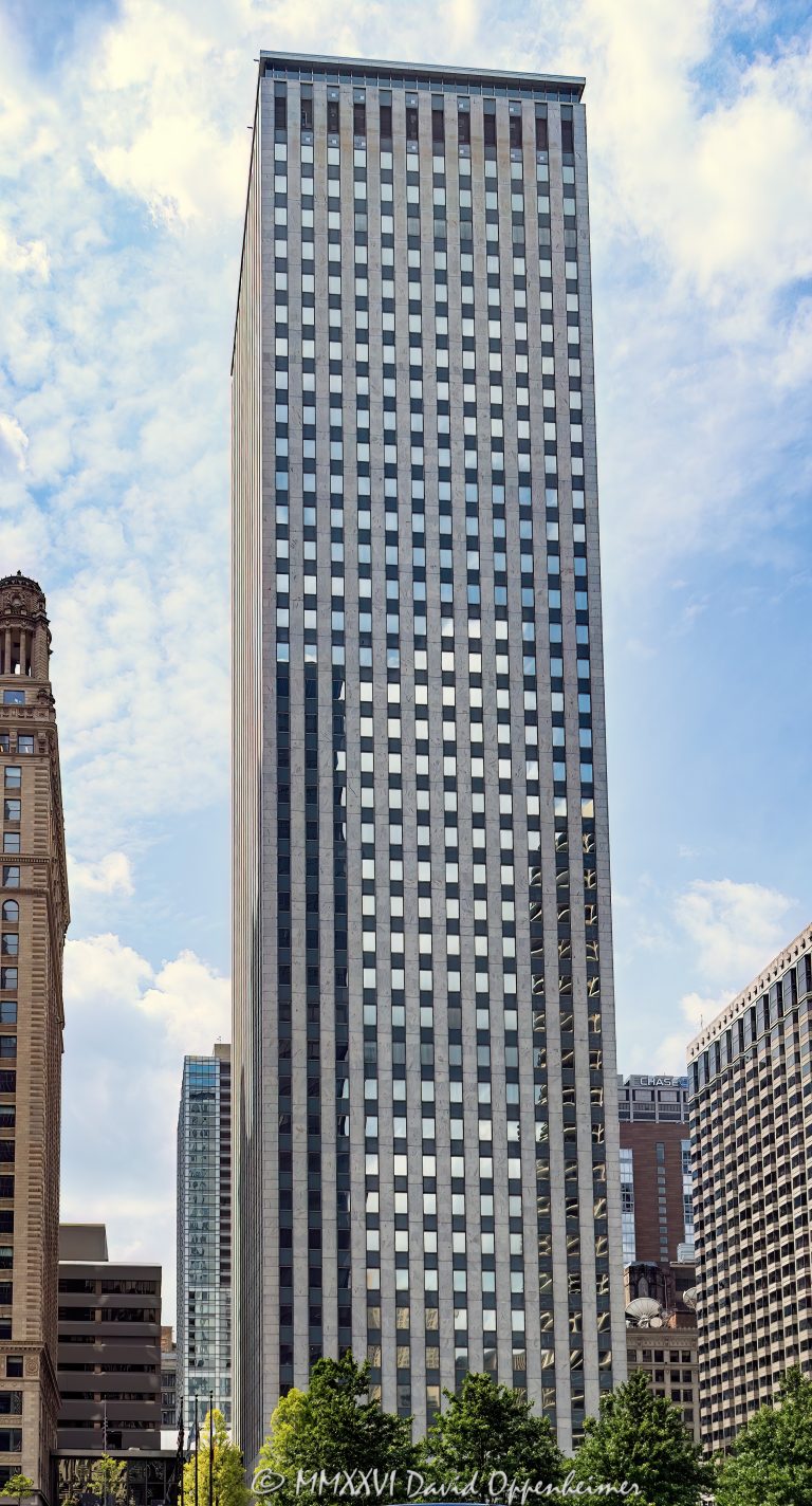 One East Wacker Drive rises at State Street and Wacker Drive along the Chicago River, showing the modernist office tower’s white marble facade and strong vertical lines in the Loop. Designed by Shaw Metz & Associates, the 41-story skyscraper is also widely known as the Kemper Building and was formerly associated with the Unitrin and United Insurance names – © 2026 David Oppenheimer – Performance Impressions photography archives https://performanceimpressions.com One East Wacker Drive, 1 East Wacker Drive, One East Wacker, 1 E Wacker Drive, 1 E Wacker Dr, One East Wacker Chicago, 1 East Wacker Chicago, Kemper Building, Kemper Building Chicago, Kemper Corporation, Unitrin Building, United Insurance Building, United of America Building, State and Wacker, State Street and Wacker Drive, Chicago Loop, Loop Chicago, downtown Chicago, Chicago Illinois, Chicago IL, East Wacker Drive, Wacker Drive, North State Street, State Street, Chicago River, Chicago Riverwalk, Riverwalk Chicago, Chicago riverfront, riverfront, Marina City area, 60601, facade, building exterior, exterior, white marble facade, marble facade, stone facade, vertical lines, modernist facade, office tower, office building, commercial building, Class A office building, skyscraper, high rise, tower, architecture, architectural photography, Chicago architecture, downtown Chicago architecture, riverfront architecture, modernist architecture, modernism, commercial architecture, Shaw Metz and Associates, Shaw Metz & Associates, Alfred Shaw, Shaw Metz Dolio, Kemper Insurance, corporate tower, business district, financial district, Chicago skyline, Illinois architecture, United States, Licensing, image licensing, commercial imagery, photography licensing, art, print, fine art, commercial photography, David Oppenheimer, vertical, 1-15156784411