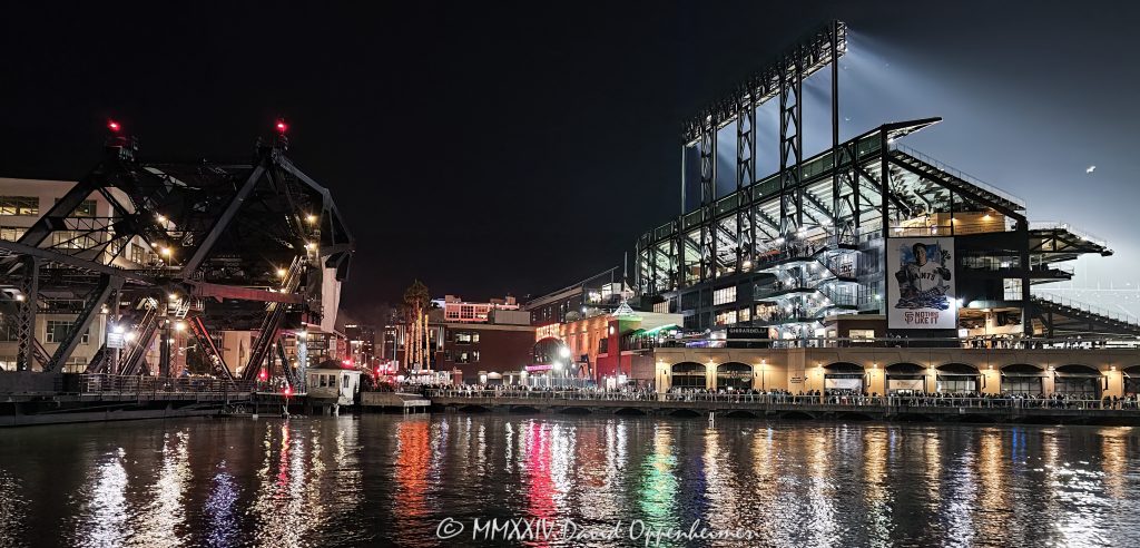Deadheads at Dead & Company Final Tour at Oracle Park at the Lefty O'Doul Gate by Willie Mays Plaza in San Francisco, California - © 2024 David Oppenheimer - Performance Impressions photography archives - https://performanceimpressions.com Dead & Company, Dead & Company Final Tour, Final Tour, tour, Oracle Park, Grateful Dead, crowd, entrance, enter, stadium, San Francisco, people, fans, deadheads, packed, packed crowd, California, line, SoMA, 3rd Street Bridge, night, lights, Mission Bay, bay, 3rd Street, building, architecture, baseball stadium, 24 Willie Mays Plz, Willie Mays Plaza, 94107, Populous, HOK Sport, HOK Sport Venue Event, outside, O’Doul Gate, Lefty O'Doul Gate, Third Street, gate, concert, concert photography, David Oppenheimer, 1-13985601741,