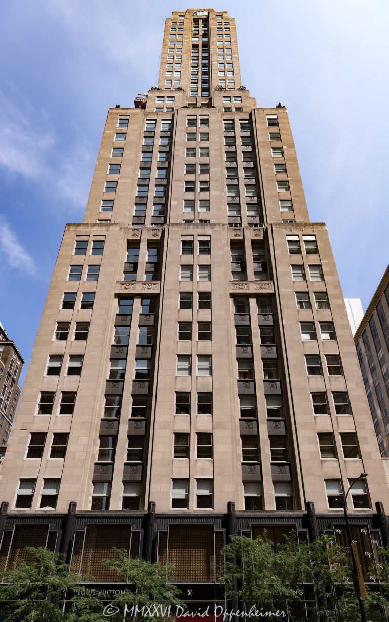 Palmolive Building at 919 North Michigan Avenue rises along Chicago’s Magnificent Mile with a smooth limestone Art Deco facade, tiered setbacks, and the restored Lindbergh Beacon crowning its tapered tower. Designed by Holabird & Root for the Colgate-Palmolive-Peet Company and later known as the Playboy Building, the landmark now combines luxury condominiums with retail space in Chicago, Illinois – © 2026 David Oppenheimer – Performance Impressions photography archives https://performanceimpressions.com Palmolive Building, Palmolive Building Chicago, Palmolive Building Landmark Residences, Palmolive Residences, The Palmolive Condos, Palmolive condos, 919 North Michigan Avenue, 919 N Michigan Avenue, 919 N Michigan Ave, 919 North Michigan, 159 East Walton Place, 159 E Walton Place, 159 E Walton Pl, North Michigan Avenue, Michigan Avenue, Walton Place, Magnificent Mile, Mag Mile, Streeterville, Streeterville Chicago, Near North Side, downtown Chicago, Chicago, Chicago Illinois, Chicago IL, Illinois, 60611, facade, building exterior, exterior, tower exterior, upper tower, limestone facade, stone facade, Bedford limestone, limestone, terra cotta, terra cotta spandrels, Art Deco, Art Deco architecture, Art Deco skyscraper, setback skyscraper, historic architecture, landmark architecture, Chicago architecture, Michigan Avenue architecture, architectural photography, architecture, tiered setbacks, stepped setbacks, stepped tower, tapered tower, sculptural tower, vertical lines, vertical emphasis, geometric facade, geometric design, streamlined facade, ornate facade, beacon, Lindbergh Beacon, Palmolive Beacon, aviation beacon, beacon mast, rooftop beacon, Charles Lindbergh, tower, skyscraper, high rise, building, landmark tower, historic tower, residential tower, condominium tower, mixed-use building, condominiums, condos, luxury condos, luxury residences, residential building, retail space, luxury retail, adaptive reuse, historic preservation, restoration, real estate, Chicago real estate, Streeterville real estate, condominium real estate, residential real estate, luxury real estate, retail real estate, commercial real estate, lake views, skyline views, Chicago skyline, Chicago Landmark, National Register of Historic Places, Playboy Building, former Playboy Building, Playboy Towers, Playboy Enterprises, Playboy magazine, Hugh Hefner, 919 North Michigan Building, Colgate-Palmolive-Peet Company, Colgate-Palmolive Company, Colgate-Palmolive, Palmolive Company, corporate headquarters, historic headquarters, Holabird & Root, Holabird and Root, John Augur Holabird, John Wellborn Root Jr, Gilbert Hall, Booth Hansen, Draper and Kramer, Illinois architecture, American architecture, United States, licensing, image licensing, commercial imagery, photography licensing, art, print, fine art, commercial photography, David Oppenheimer, vertical, 1-15213827141