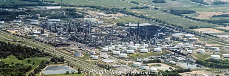 Flint Hills Resources Pine Bend Refinery at 12555 Clark Rd in Rosemount, Minnesota aerial view - © 2024 David Oppenheimer - Performance Impressions aerial photography archives - https://performanceimpressions.com Pine Bend, Pine Bend Refinery, Pine Bend Refinery aerial, Pine Bend aerial, refinery, 12555 Clark Rd, Koch Industries, Rosemount, Minnesota, Flint Hills Resources, Flint Hills Resources Pine Bend, Flint Hills, oil, petroleum, fuel, Dakota County, production, transportation fuel, liquid, energy, Midwest, gasoline, diesel, 55068, diesel fuel, heating fuel, heating oil, jet fuel, propane, asphalt, synthetics, barrels, fossil fuels, tanks, solar, solar power, emissions, CO2, carbon dioxide, greenhouse gasses, environment, carbon, carbon fuels, storage tanks, tank field, aerial, aerial view, aerial photography, aerial photographer, David Oppenheimer, color, horizontal, United States, 1-13985601741,